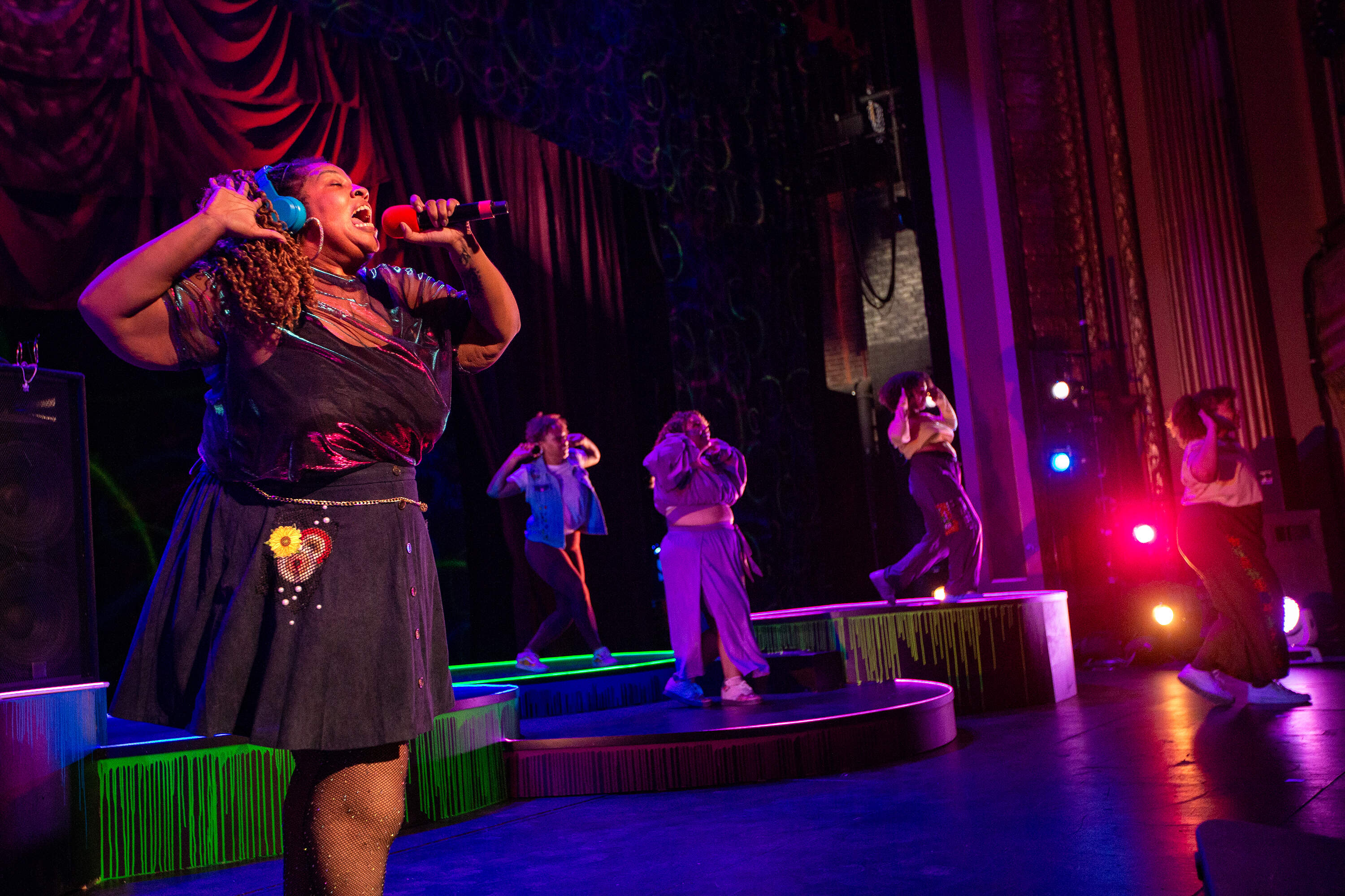 Boston rapper and artist Brandie Blaze plays a DJ in Company One's "Hoops" (Jesse Costa/WBUR)