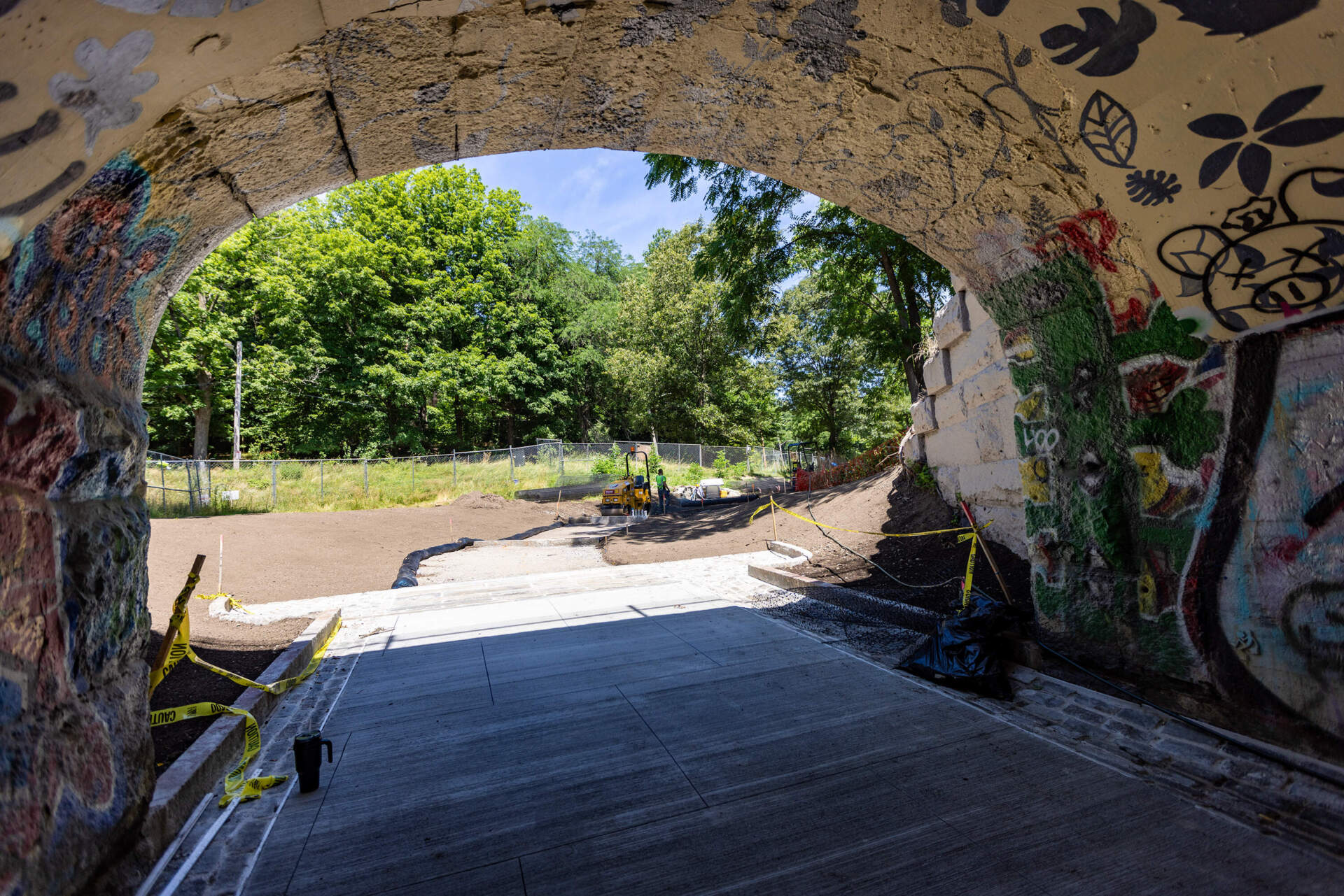 A walkway leading to the Arboretum extends from the other end of the Arboretum Road entrance railroad bridge. (Jesse Costa/WBUR)