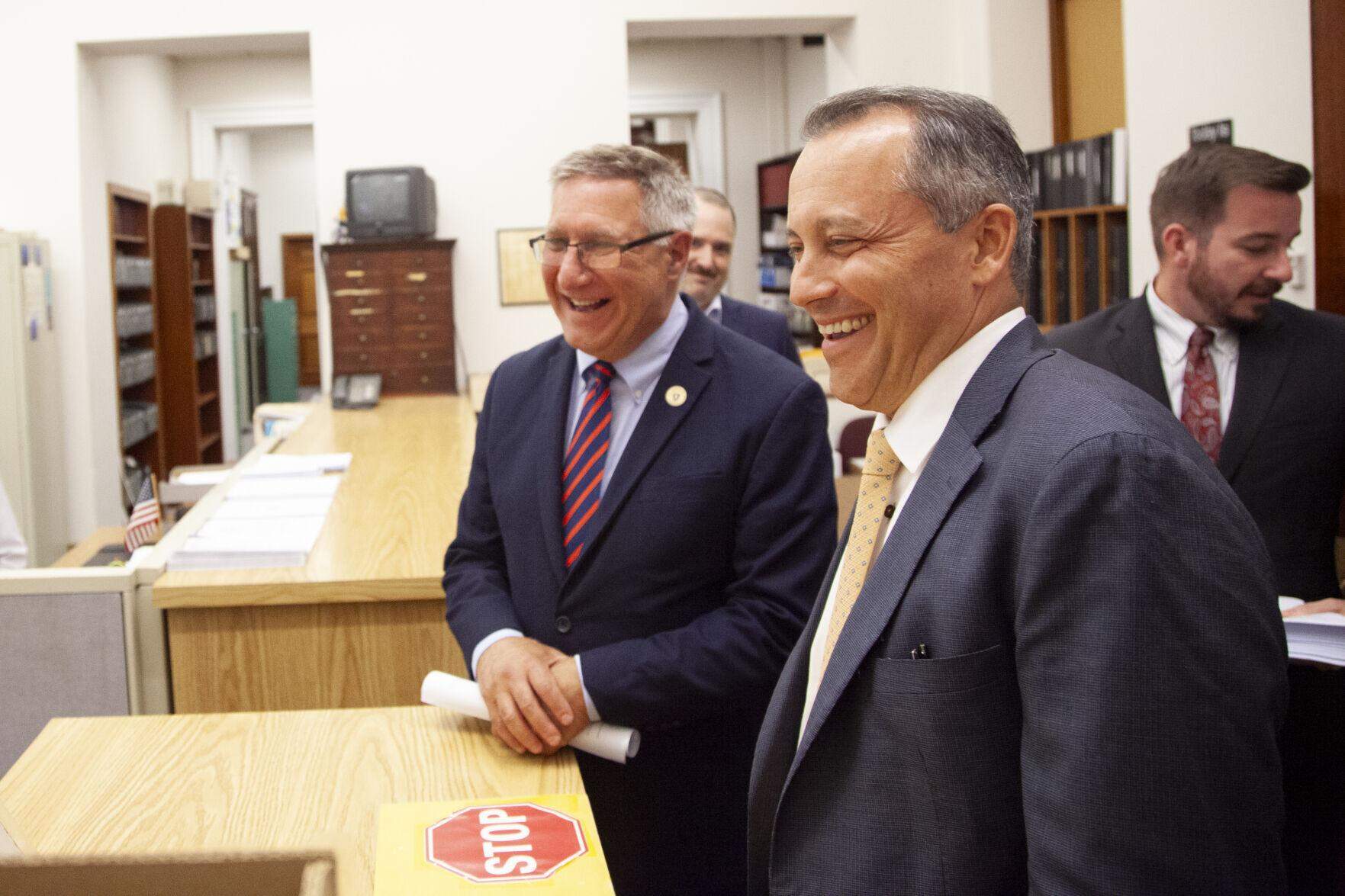 Ways and Means Committee Chairs Aaron Michlewitz (right) and Michael Rodrigues (left) drop off a compromise fiscal 2025 budget bill in the House clerk's office around 7:45 p.m. on Thursday, July 18, 2024. (Chris Lisinski/SHNS)
