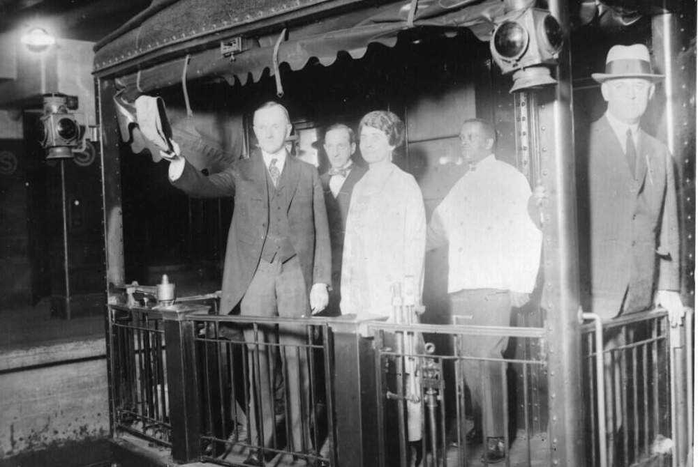 U.S. President Calvin Coolidge and his wife, first lady Grace Coolidge, are shown on the platform of their private car at Pennsylvania Station on April 23, 1924. (AP Photo)