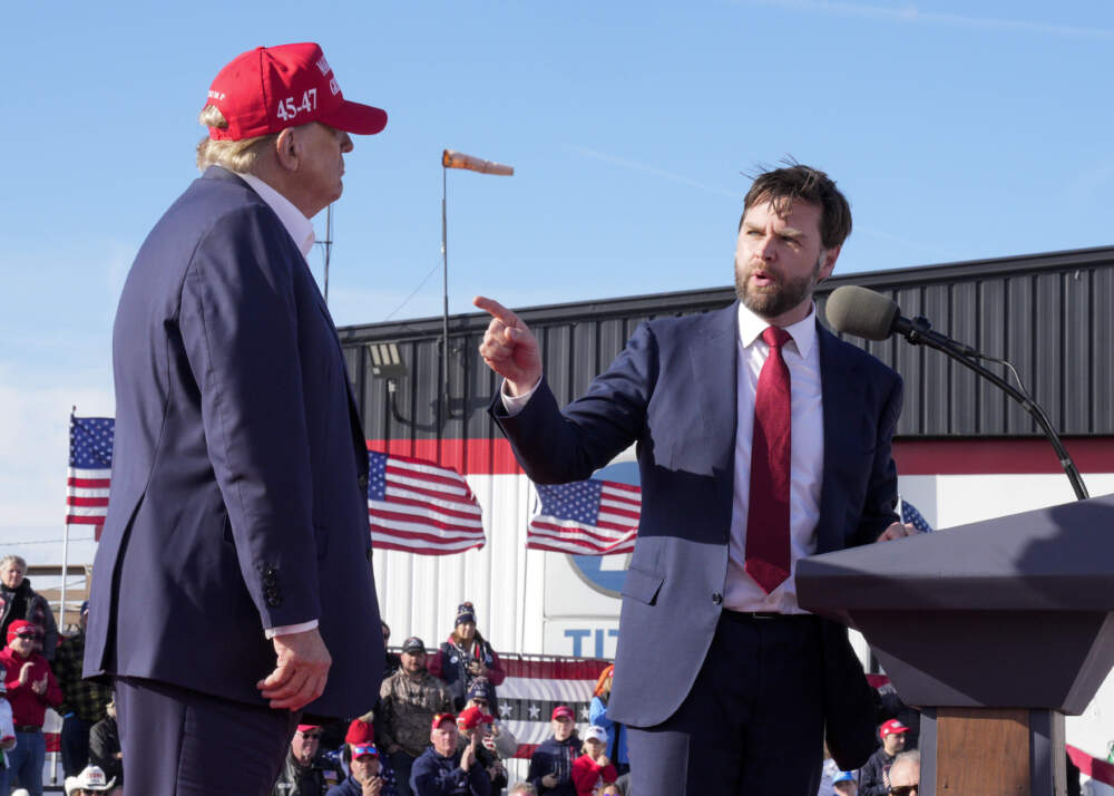 J.D. Vance, R-Ohio points toward Republican presidential candidate former President Donald Trump at an Ohio campaign rally in March. (Jeff Dean/AP)