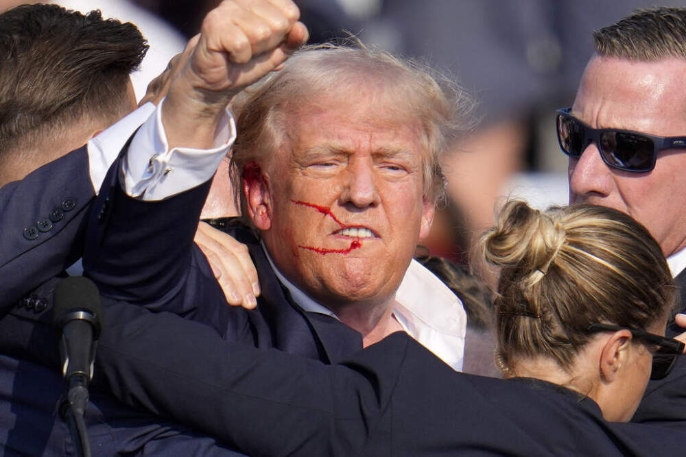 Former President Donald Trump reacts following an assassination attempt at a campaign event in Butler, Pa., on Saturday, July 13, 2024. (Gene J. Puskar/AP)