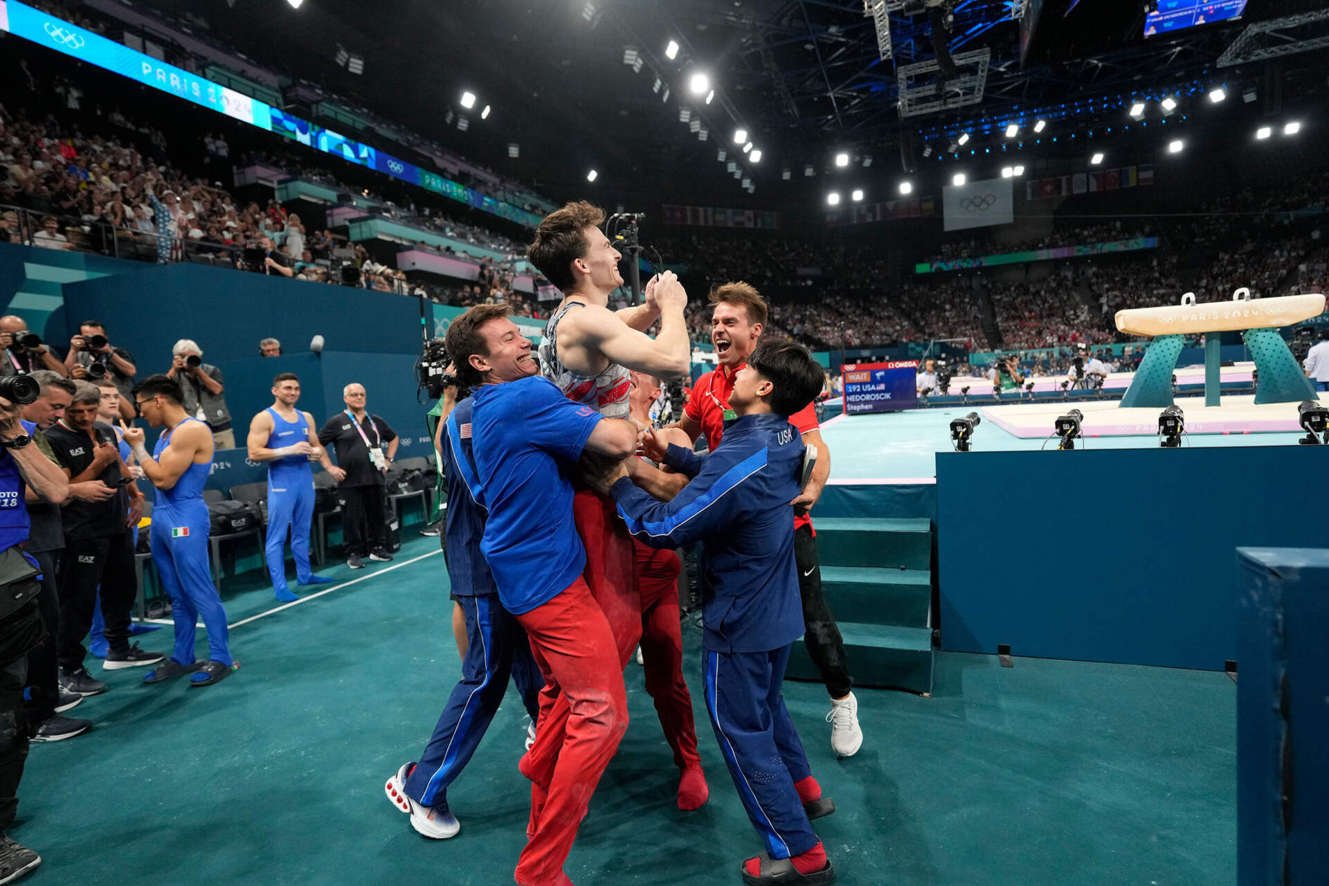 Stephen Nedoroscik, of United States, is lifted by teammates after pommel horse during the men's artistic gymnastics team finals round at Bercy Arena in Paris, France. (Abbie Parr/AP)