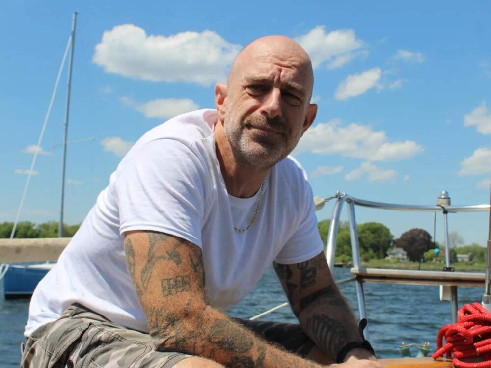 In the summers, Riley lives on a sailboat moored in Narragansett Bay. (Ben Berke/The Public's Radio)