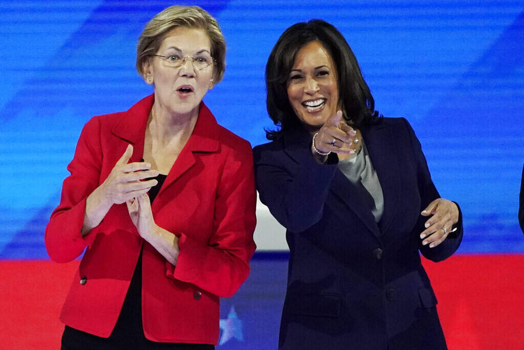 Sen. Elizabeth Warren stands next to Vice President Kamala Harris onstage at Texas Southern University before a Democratic presidential primary debate during their respective presidential campaigns in 2019. (David J. Phillip/AP)