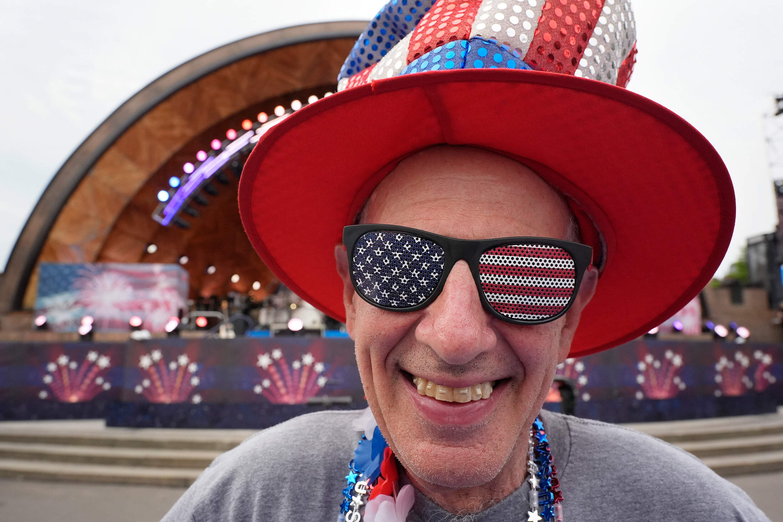 Doc Rutstein, of Braintree, Mass., poses for a photo before the Boston Pops Fireworks Spectacular. (Michael Dwyer/AP)