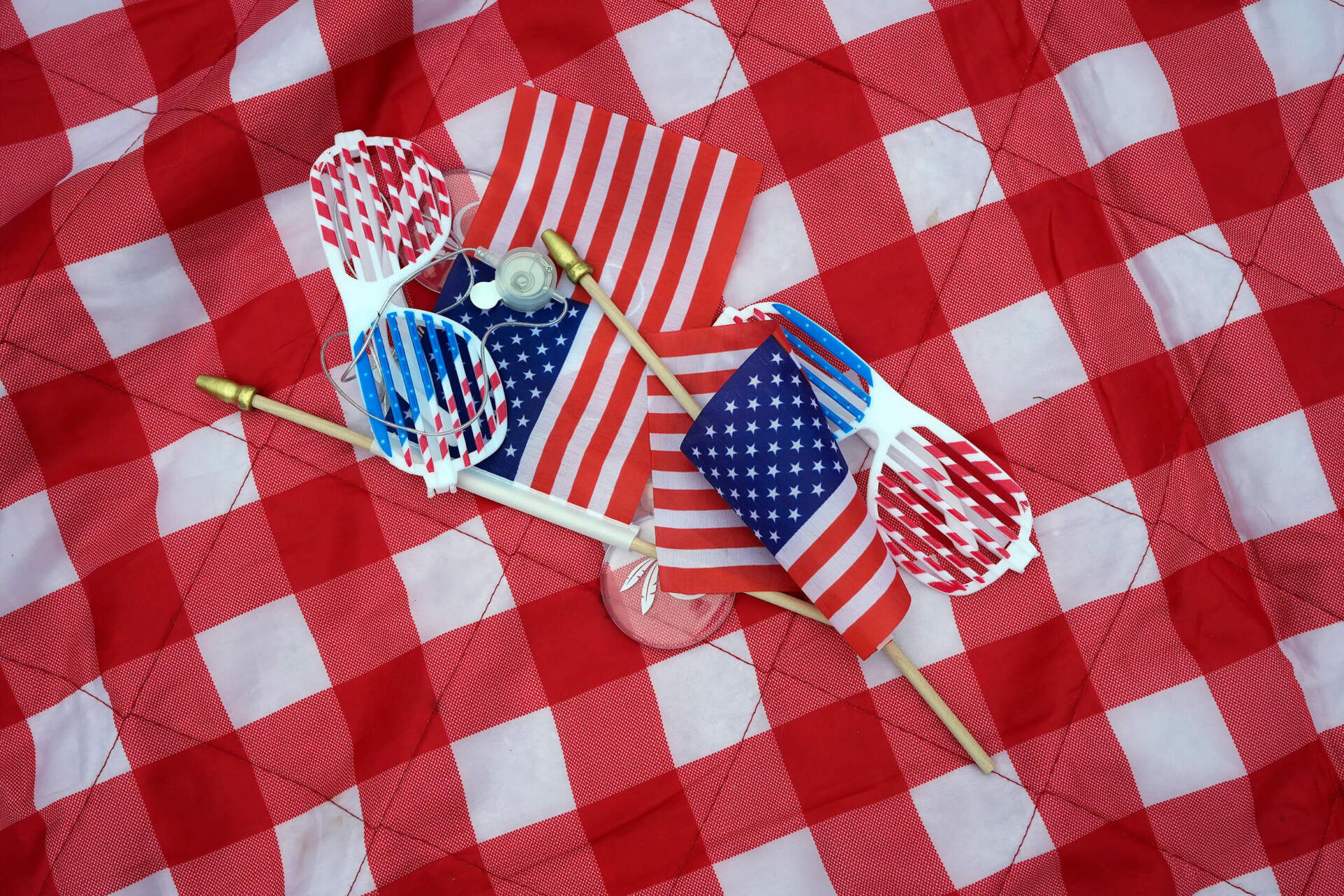 Patriotic souvenirs lie on a picnic blanket before the Boston Pops Fireworks Spectacular. (Michael Dwyer/AP)