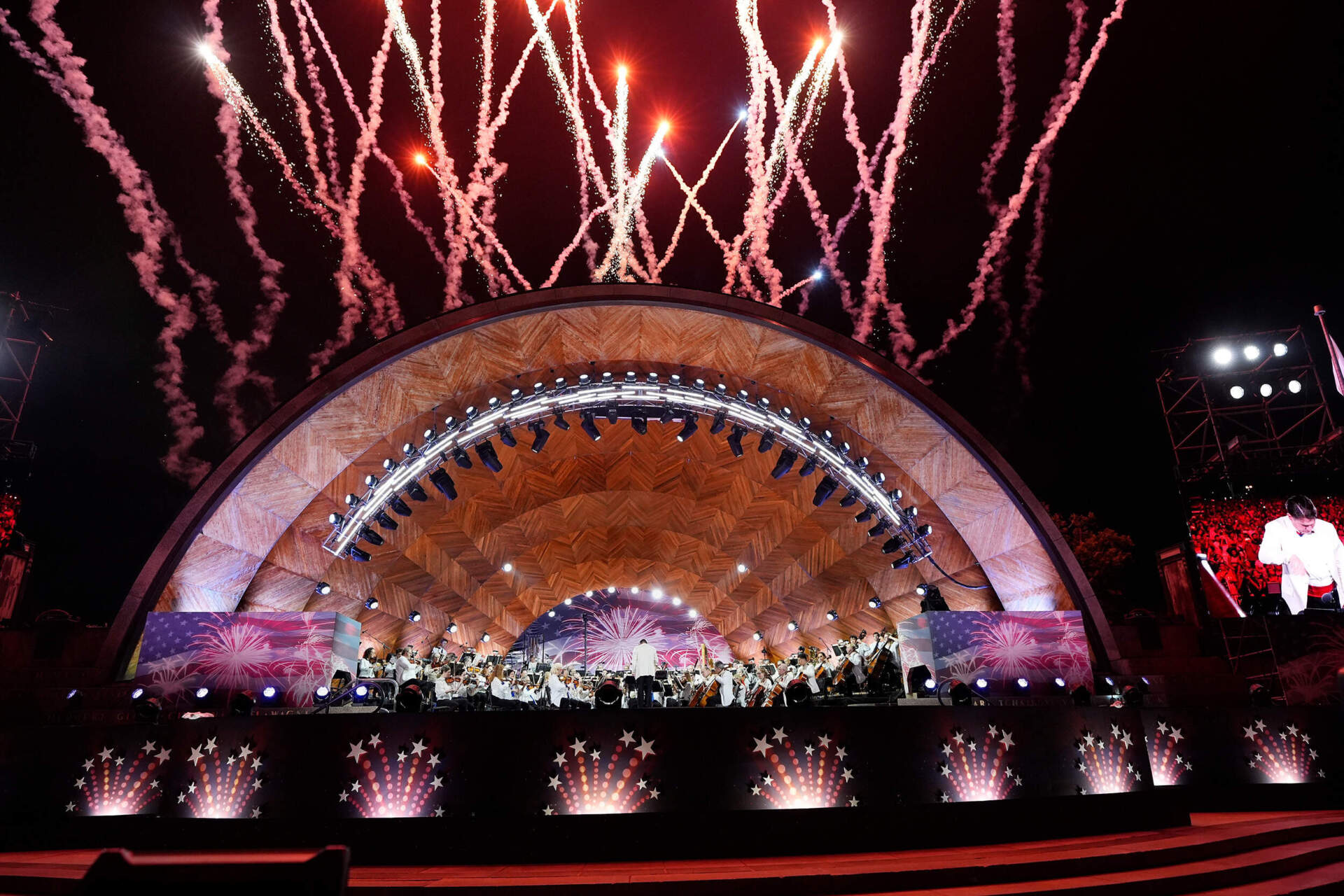 The Boston Pops Esplanade Orchestra performs during the Boston Pops Fireworks Spectacular at the Hatch Memorial Shell. (Michael Dwyer/AP)