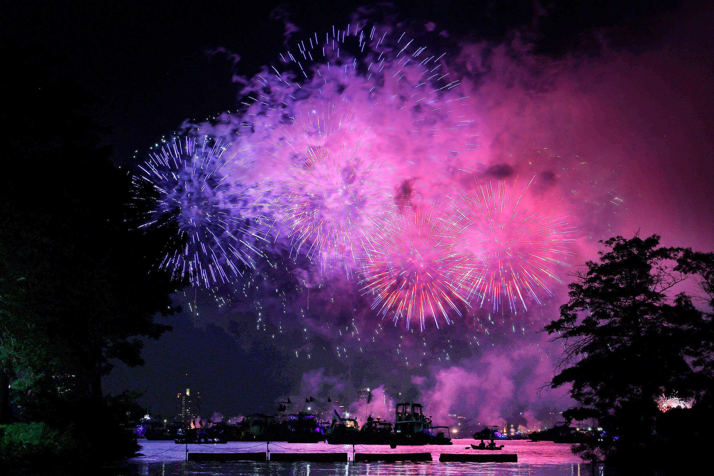 Fireworks explode over the Charles River. (Michael Dwyer/AP)