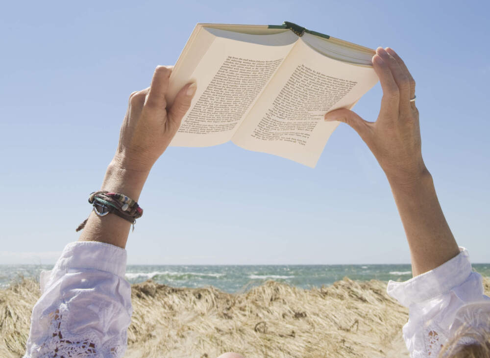 Someone reads at the beach. (Chris Hackett/Getty Images)