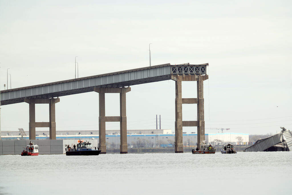 One remaining end of the Francis Scott Key Bridge stands in the water after the bridge collapsed when the cargo ship Dali ran into and collapsed it on March 26, 2024 in Baltimore, Maryland. (Kevin Dietsch/Getty Images)