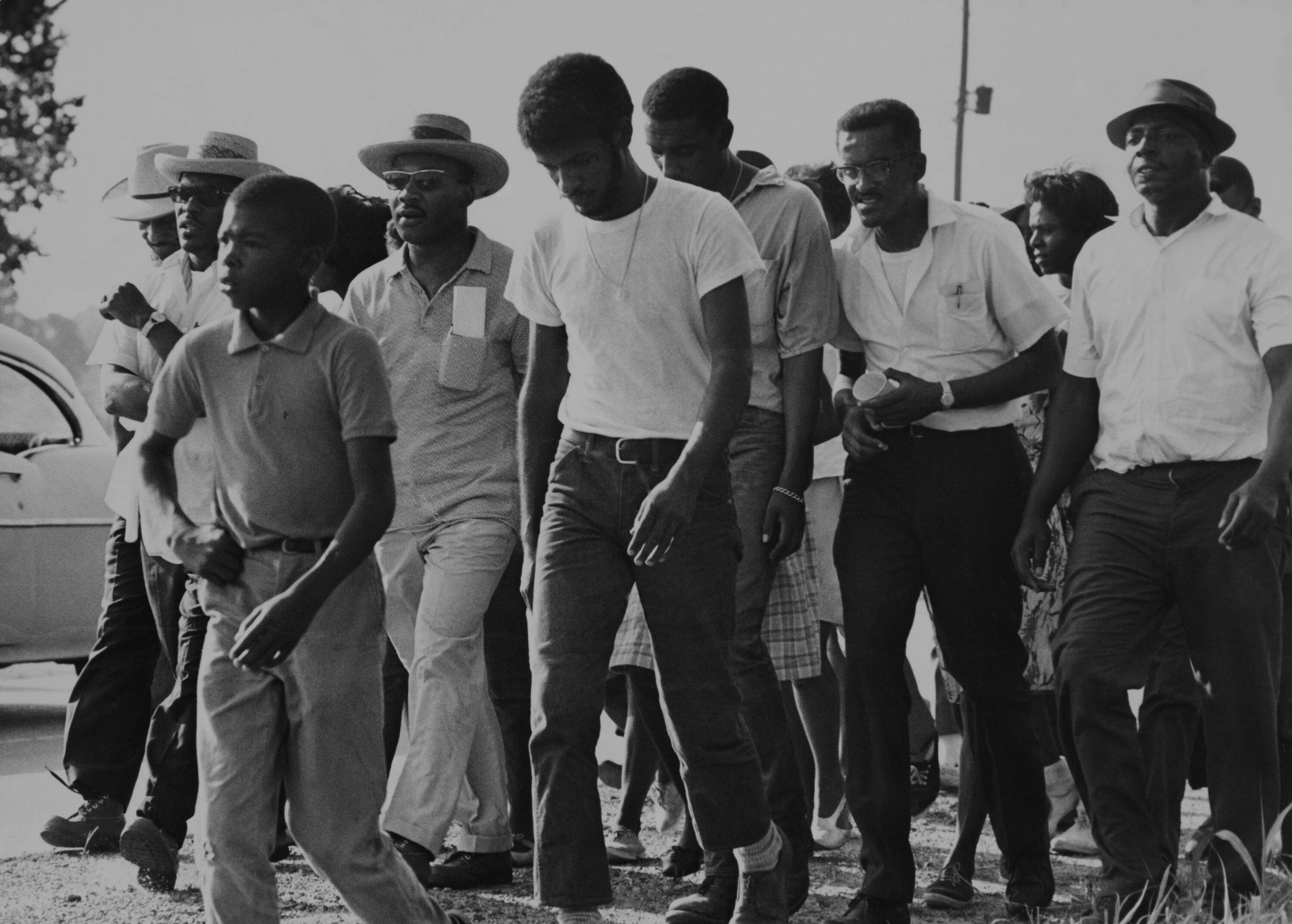 American civil rights activists Martin Luther King Jr (1929 - 1968), Cleveland Sellers, and Kwame Ture (Stokely Carmichael, 1941 - 1998), helping guiding marchers heading towards Jackson, Mississippi, during the March Against Fear, June 11, 1966. (Daily Express/Pictorial Parade/Getty Images)