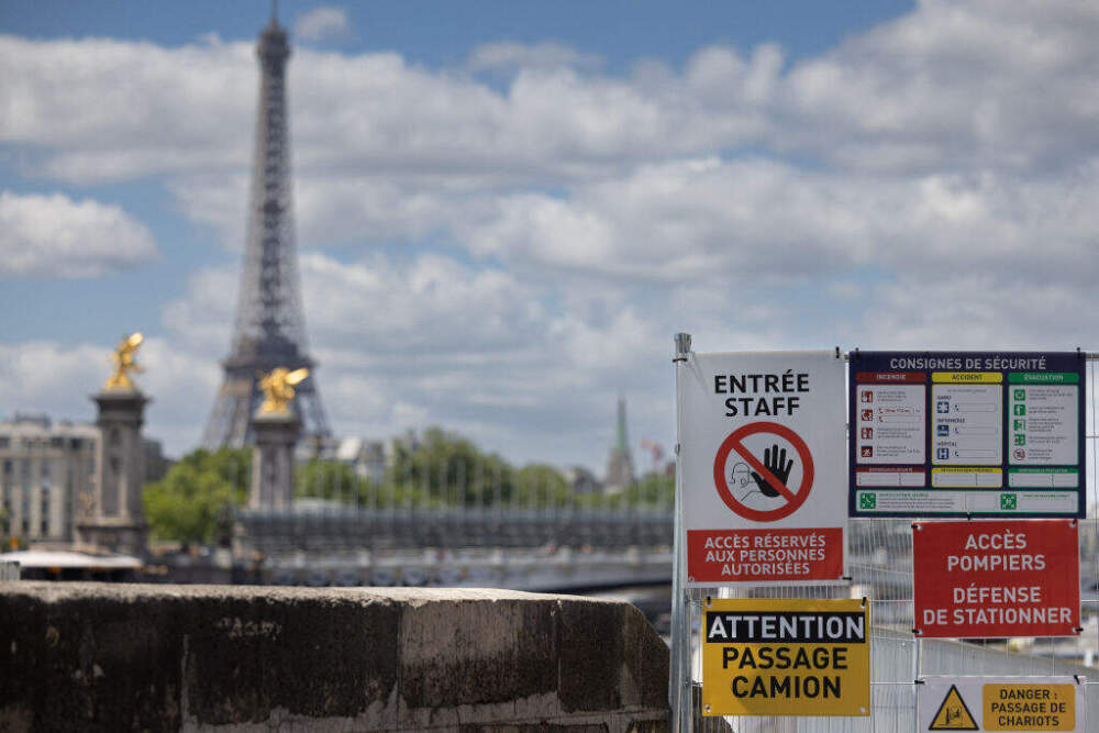 Signs prohibit access to the banks of the Seine during preparation for the Paris 2024 Olympic Games on July 4. (Joel Saget/AFP via Getty Images)