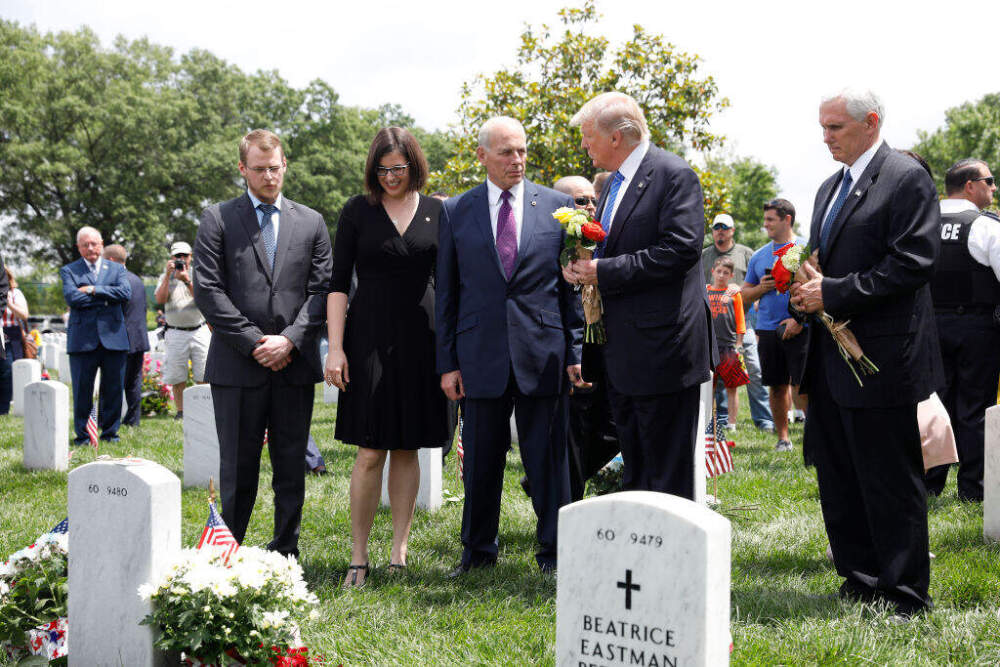 President Donald Trump speaks with Secretary of Homeland Security John Kelly and Vice President Mike Pence before laying flowers on the grave of Kelly's son, First Lieutenant Robert Kelly, at Arlington National Cemetery on May 29, 2017 in Arlington, Virginia. Lt. Kelly was killed in 2010 while leading a patrol in Afghanistan. (Aaron P. Bernstein/Getty Images)