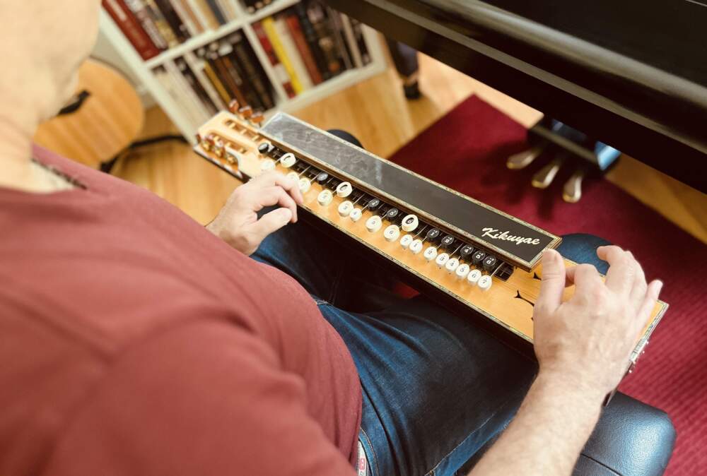 Eric Shimelonis plays the taishōgoto: a Japanese instrument combining strings and buttons. (courtesy of Rebecca Sheir)