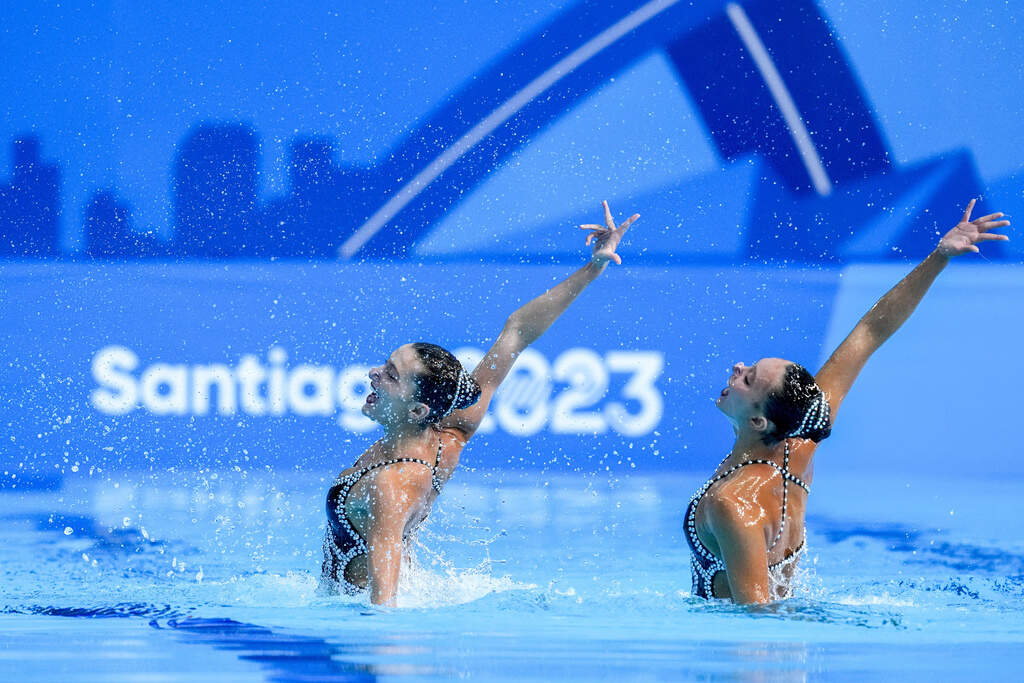 Megumi Field and Ruby Remati of the United States compete in the artistic swimming duets free routine final at the Pan American Games. (Esteban Felix/AP)