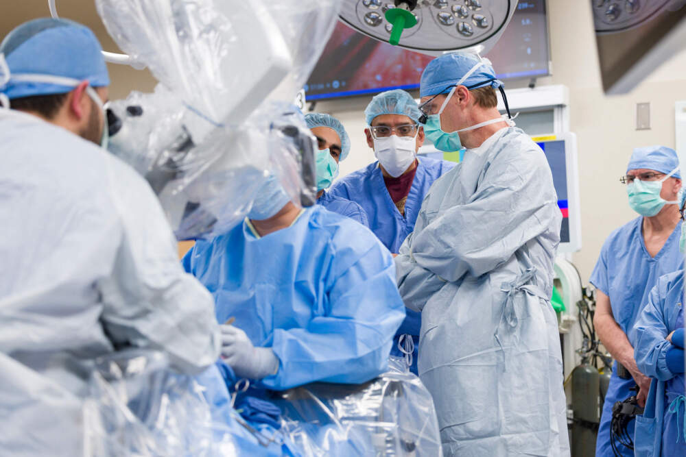 Dr. Girish Mour, second from right, and Dr. David Lott, right, during the larynx transplant surgery.(Courtesy of Mayo Clinic)