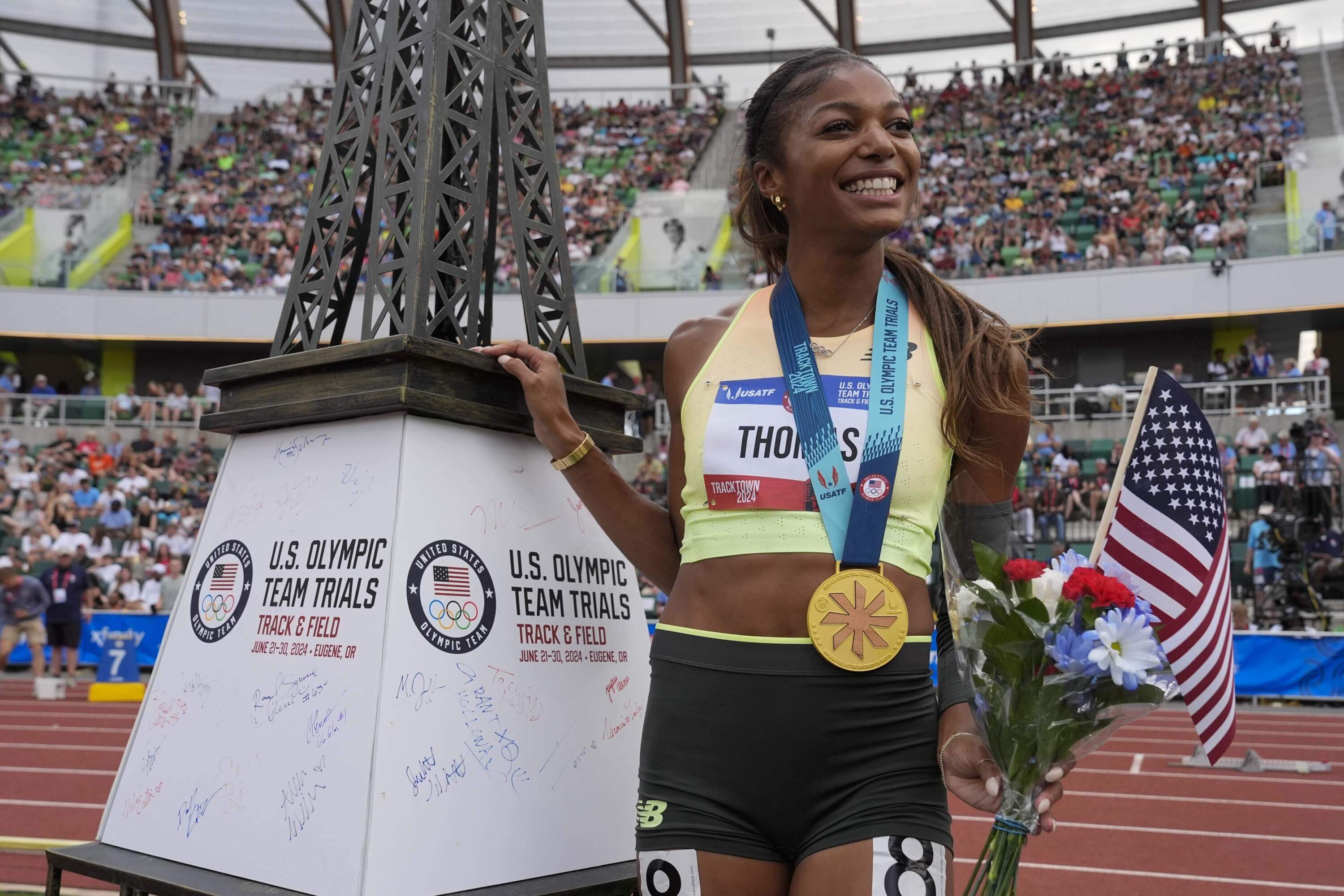 Gabby Thomas celebrates after winning the women's 200-meter final during the U.S. Track and Field Olympic Team Trials. (George Walker IV/AP)