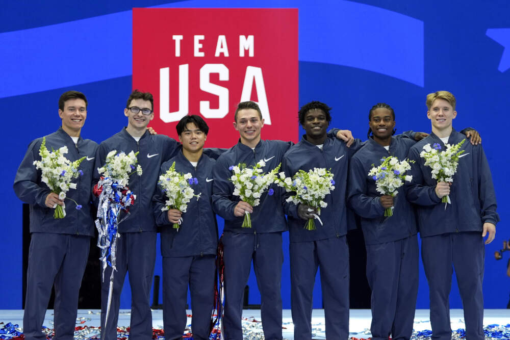 From left to right, Brody Malone, Stephen Nedoroscik, Asher Hong, Paul Juda, Frederick Richard, Khoi Young and Shane Wiskus celebrate after being named to the 2024 Olympic team at the United States Gymnastics Olympic Trials on Saturday, June 29, 2024, in Minneapolis. (Charlie Riedel/AP)