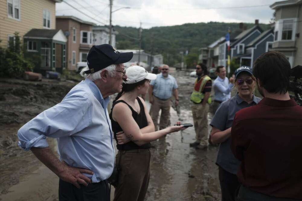 Sen. Bernie Sanders tours flood damage in Barre on July 12, 2023. “This is really horrific, and I’m just thinking about the kind of expense involved in having to do cleanup,” he said. (Joey Palumbo/Vermont Public)