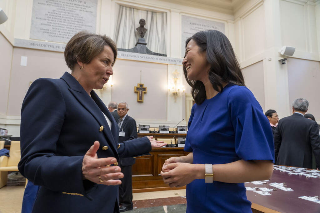 Gov. Maura Healey talks to Boston Mayor Michelle Wu during a break of the opening session of the "From Climate Crisis to Climate Resilience" three-day summit at The Vatican. (Domenico Stinellis/AP)