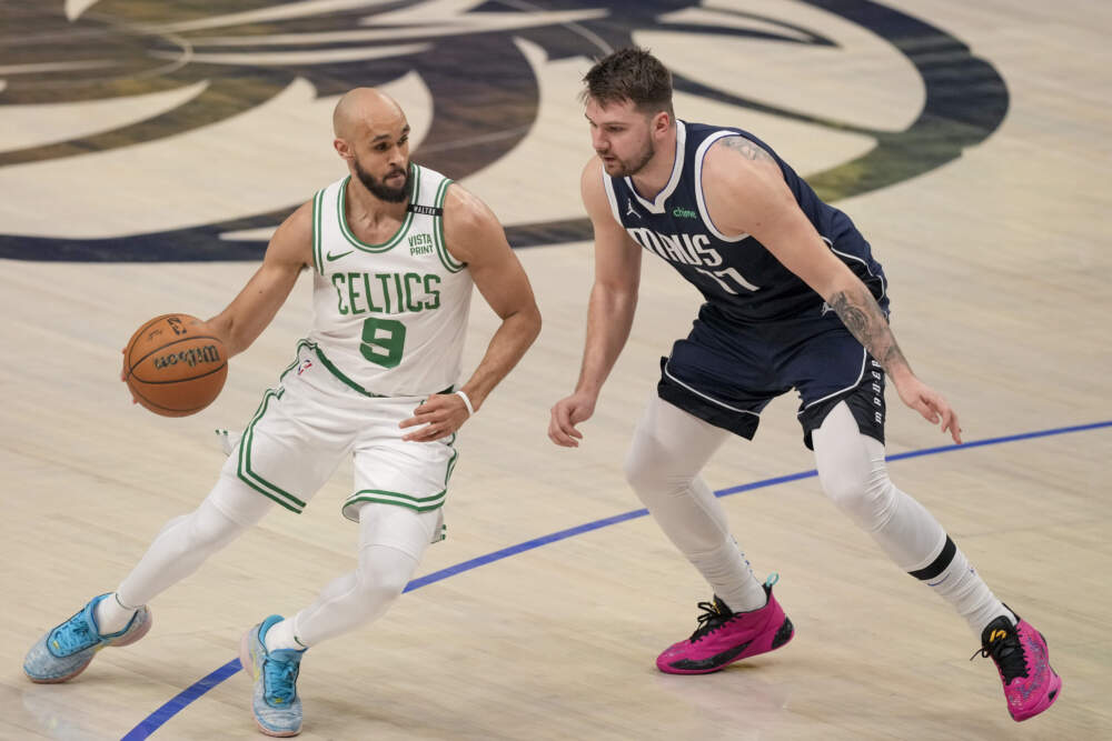 Boston Celtics guard Derrick White, left, works the floor against Dallas Mavericks guard Luka Doncic during the first half in Game 3 of the NBA basketball finals on June 12 in Dallas. (Sam Hodde/AP)