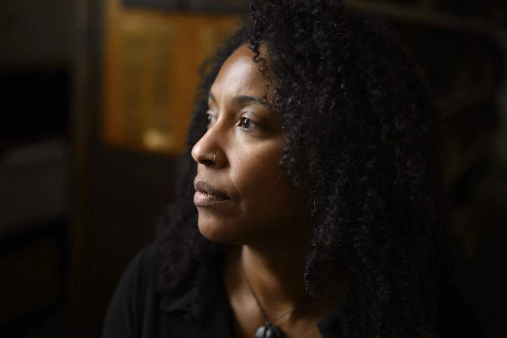 Senior Curator of Maritime Social Histories Akeia de Barros Gomes sits for a portrait at the Mystic Seaport Museum on June 11, 2024. She said a first step in creating the 'Entwined' exhibition was to ask local tribal and Black communities how they would tell their maritime history. (Ryan Caron King/Connecticut Public)
