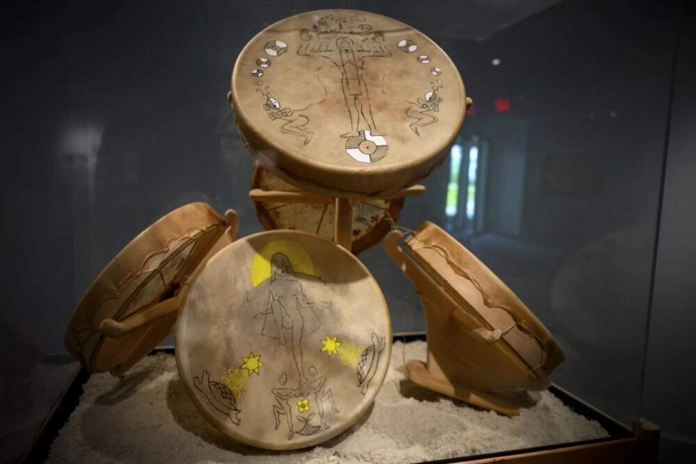 “Drums from All Directions,” a piece created by Sherenté Mishitashin Harris of the Narragansett tribe, sits on display as part of the “Entwined” exhibition at the Mystic Seaport Museum. (Ryan Caron King/Connecticut Public)
