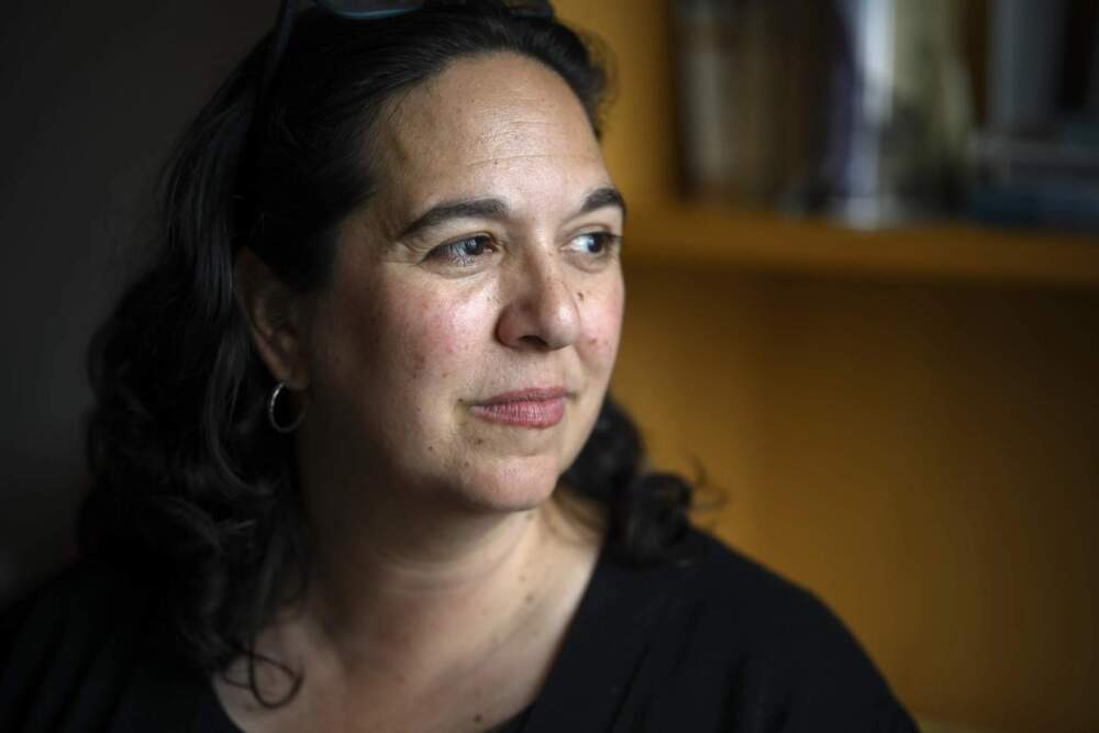 Director of Research and Scholarship Elysa Engelman sits for a portrait in her office at the Mystic Seaport Museum on June 11, 2024. She says she hopes that visitors who are new to Indigenous and Black maritime history can gain new perspective from the “Entwined" exhibition. (Ryan Caron King/Connecticut Public)