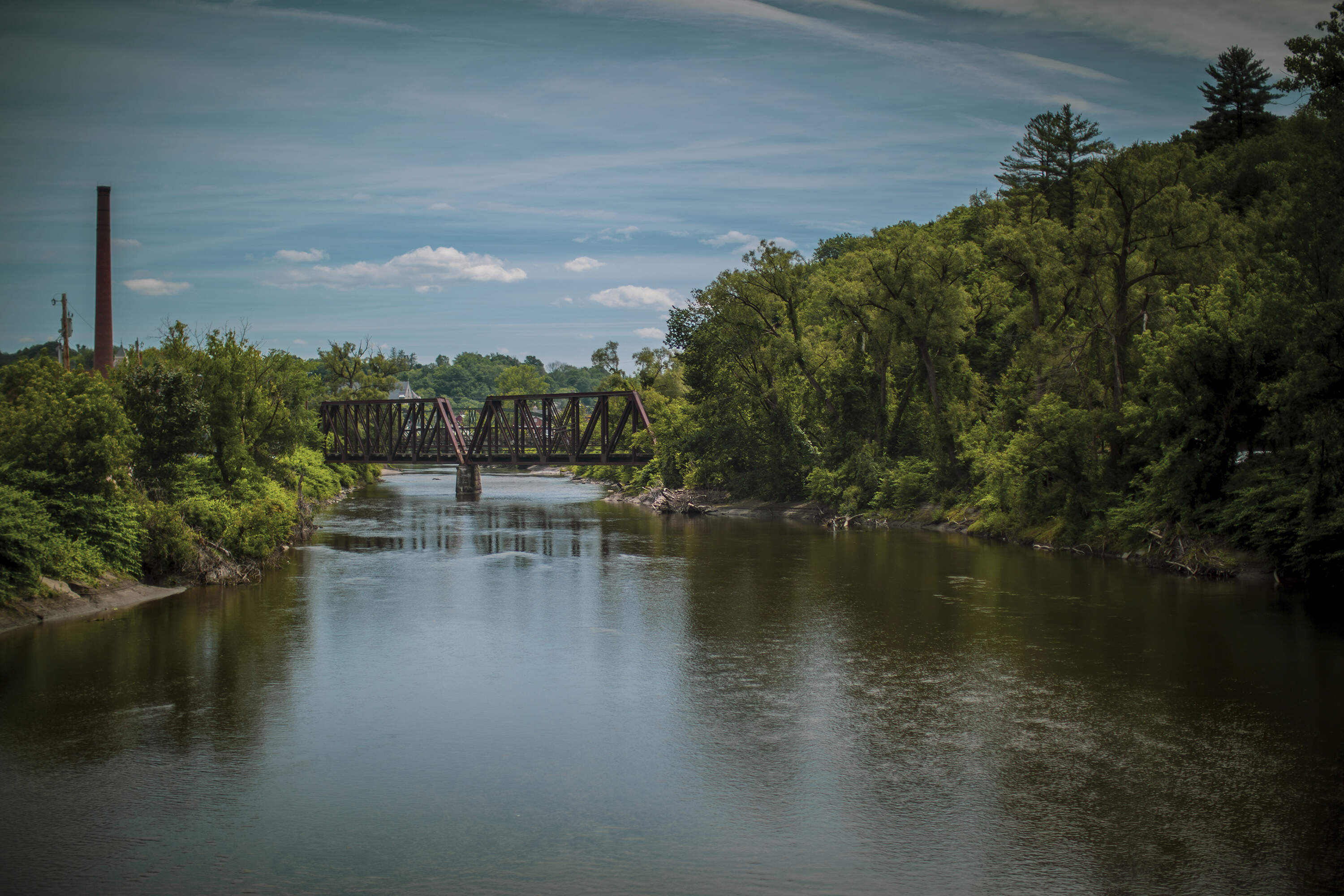 A July 3, 2024, view of the Winooski River that flooded Montpelier, Vermont, in 2023. A year after catastrophic flooding inundated parts of Vermont, some homeowners are still in the throes of recovery. (Dmitry Belyakov/AP)