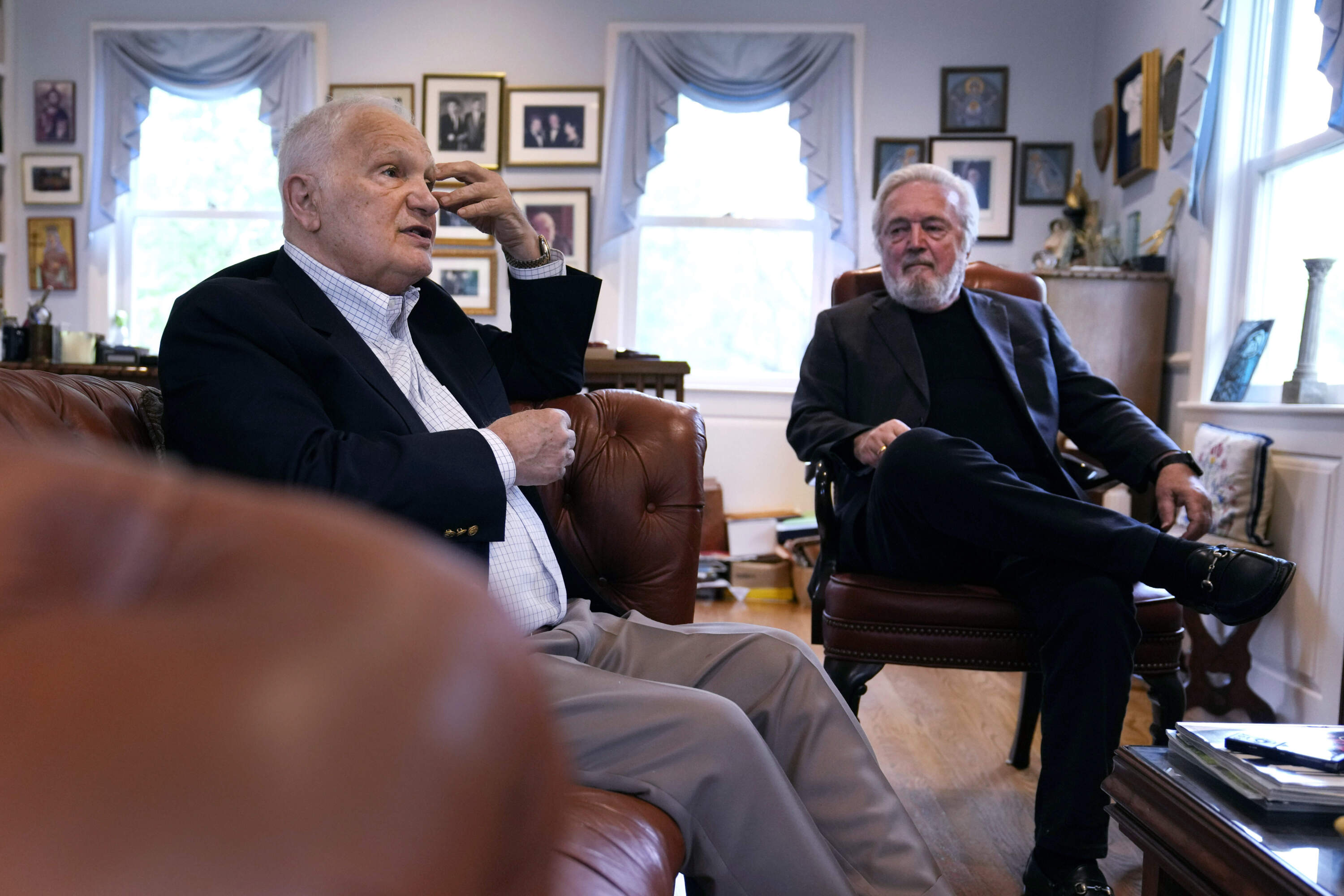 Nicholas Basbanes, left, is interviewed with his longtime friend Nick Gage. Authors and retired newspaper journalists Gage and Basbanes decided to sue ChatGPT-maker OpenAI and its business partner Microsoft when they found out that ChatGPT might be stealing and repurposing a lifetime of their work. (Charles Krupa/AP)