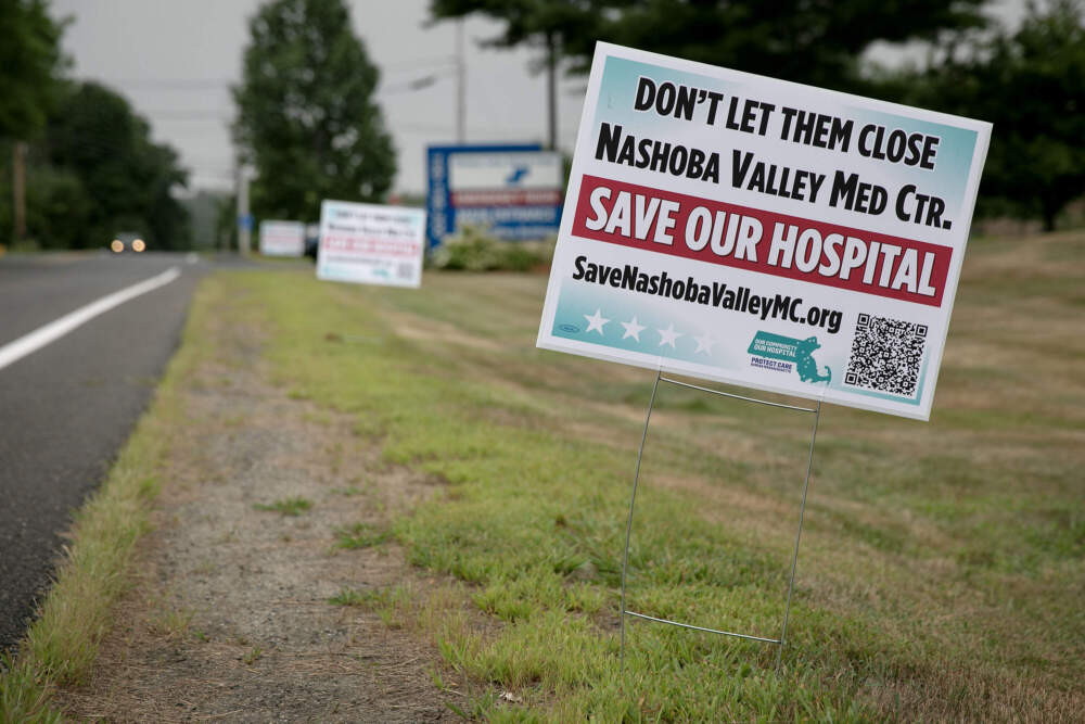 A &quot;save our hospital&quot; sign by the entrance to the Nashoba Valley Medical Center in Ayer. (Robin Lubbock/WBUR)