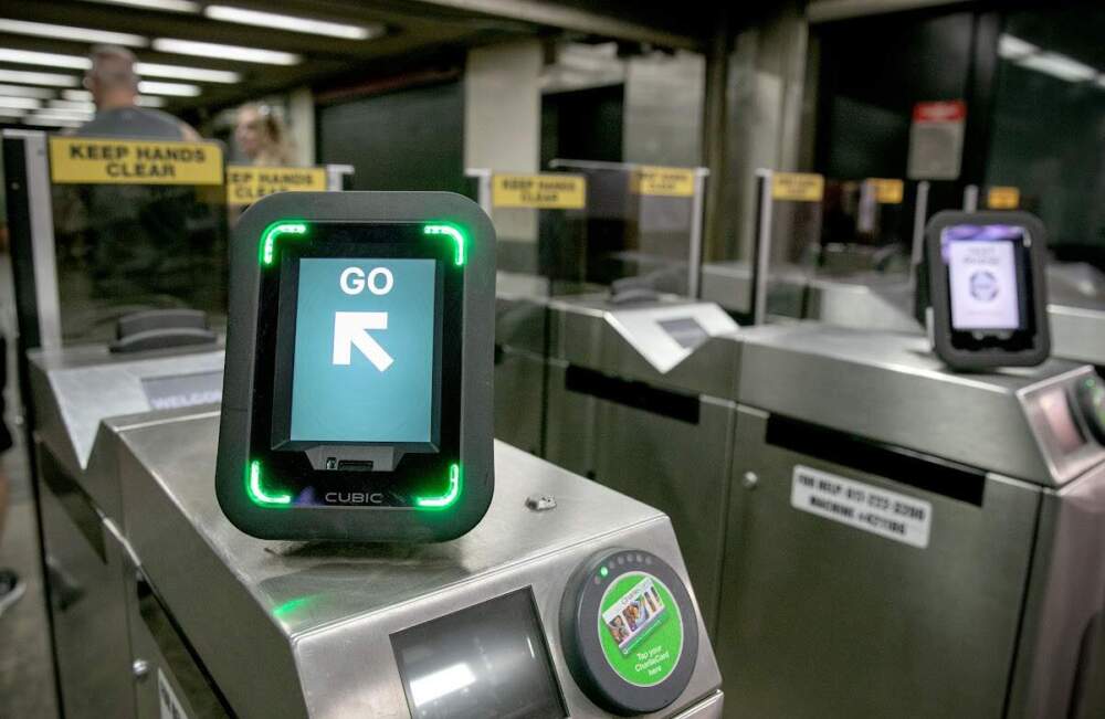 The MBTA's new readers, mounted on turnstiles and onboard buses, starts accepting credit cards and smartphones for fare payments Thursday, Aug. 1. (Robin Lubbock/WBUR)