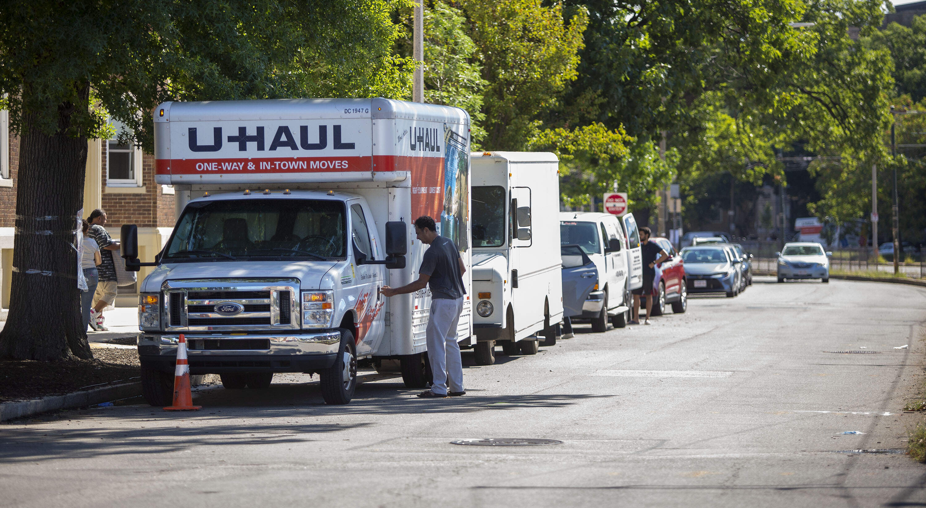 Moving vans loading up on Commonwealth Ave. (Robin Lubbock/WBUR)