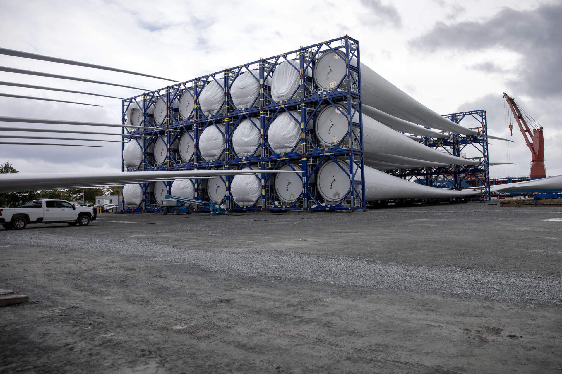 Wind turbine blades stacked on the dock at the New Bedford Marine Commerce Terminal. (Robin Lubbock/WBUR)