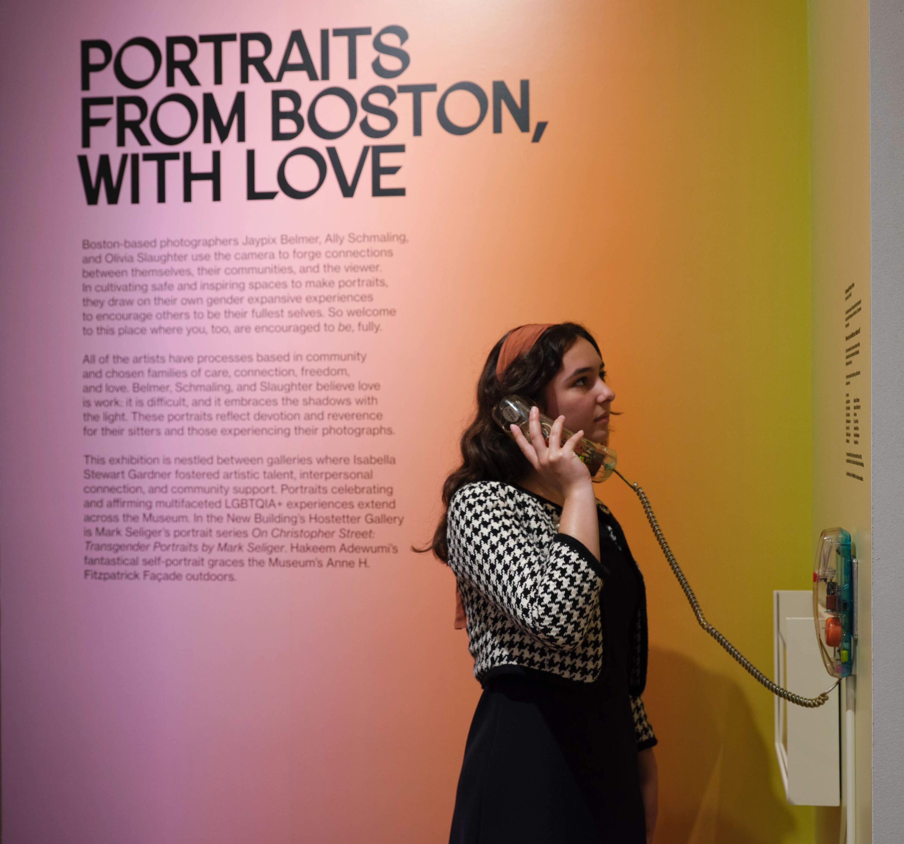 A visitor listening to a message from the "Community Voices Phone" by Crystal Bi. (Courtesy Isabella Stewart Gardner Museum)