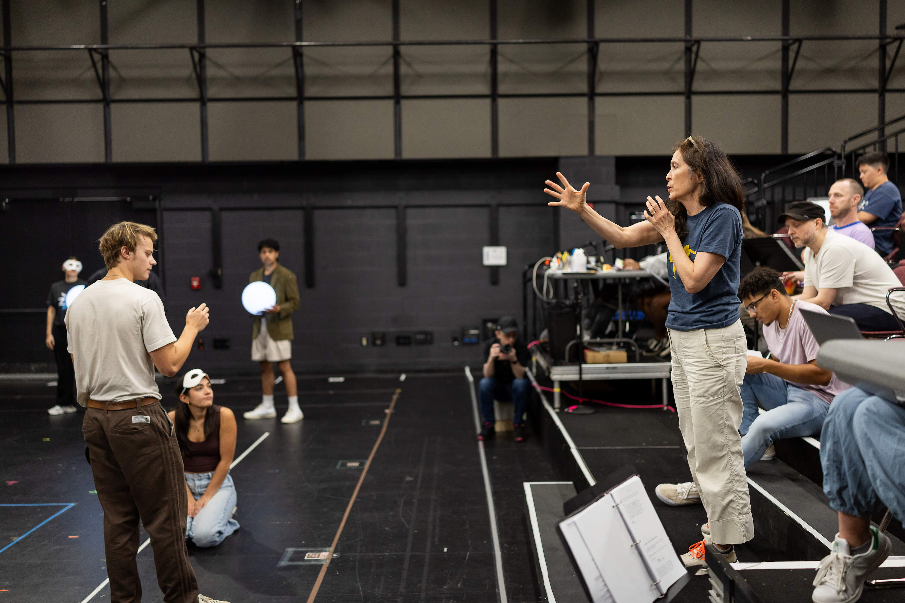 Diane Paulus, right, leads the cast during rehearsals for "Romeo and Juliet." (Courtesy of ART)