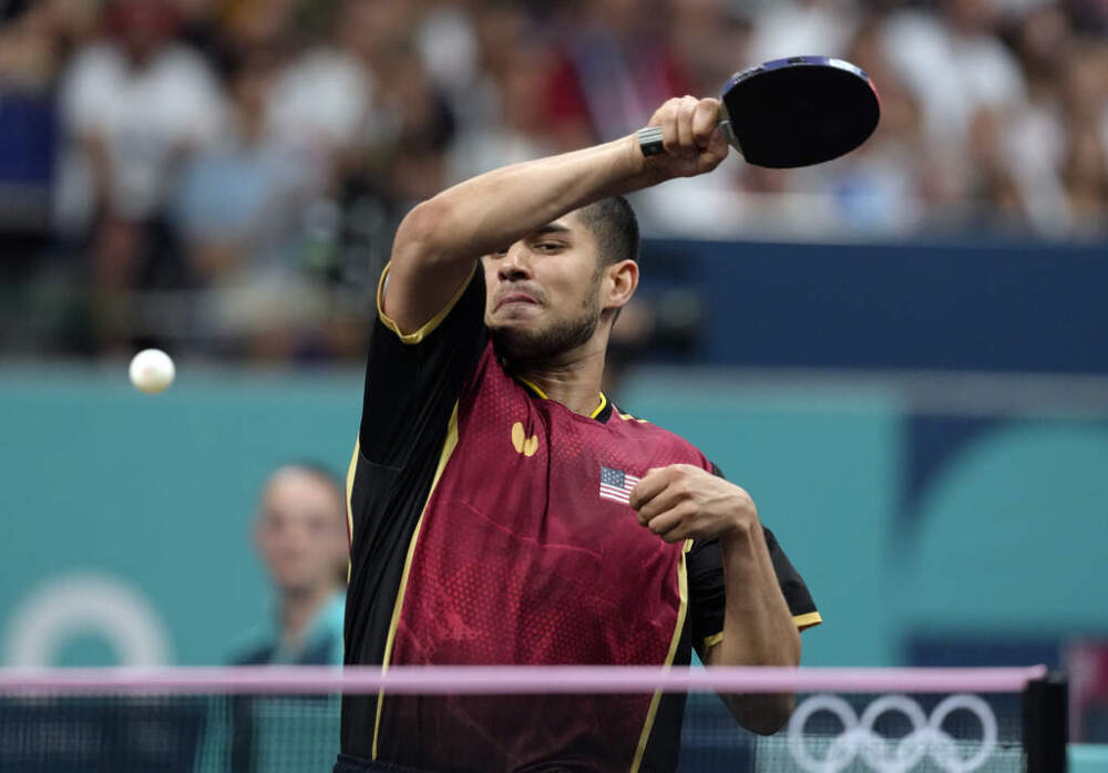 United States' Kanak Jha plays against Greece's Panagiotis Gionis during a men's singles round of 32 table tennis game at the 2024 Summer Olympics, Wednesday, July 31, 2024, in Paris, France. (Petros Giannakouris/AP)