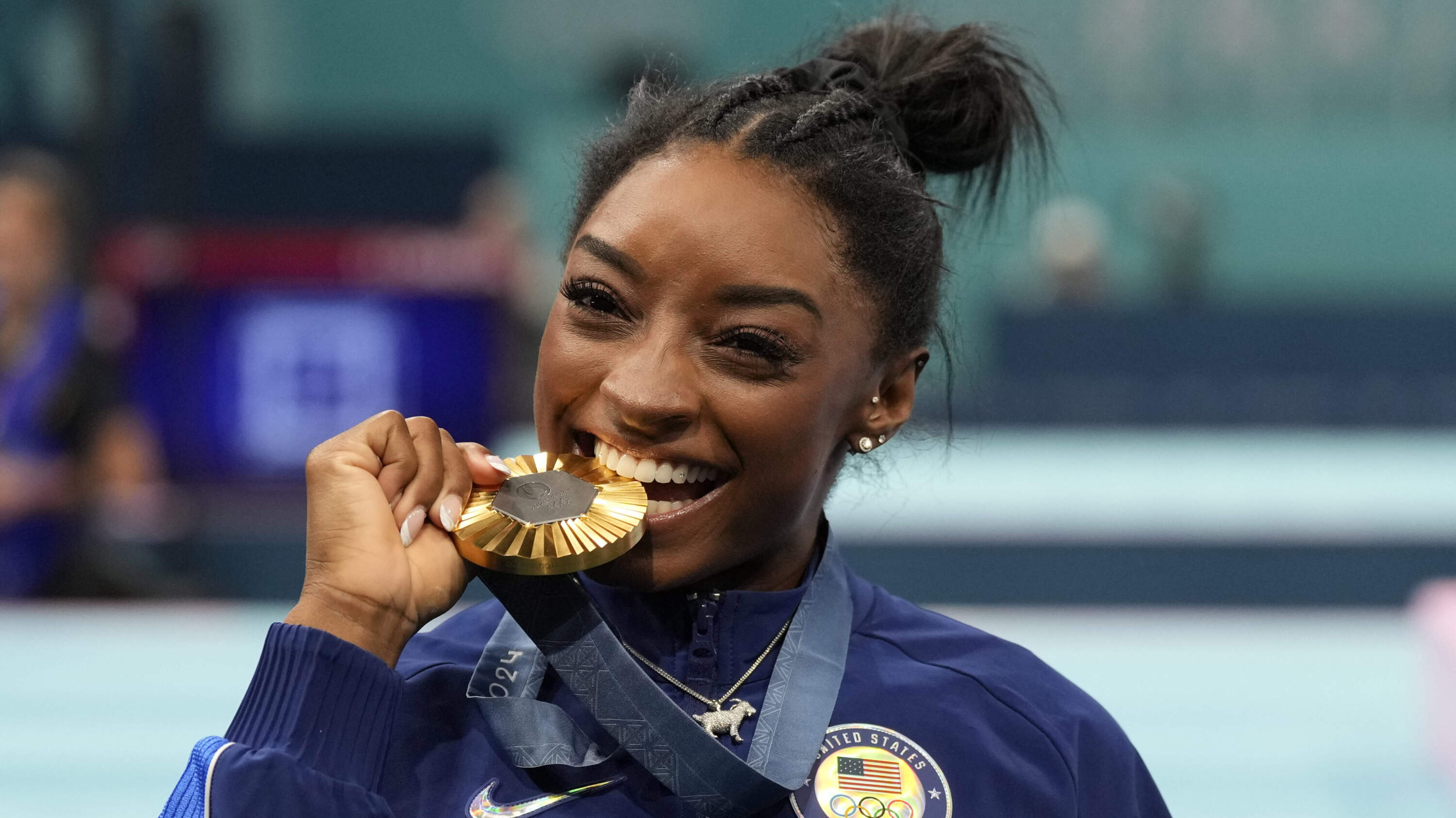 Simone Biles celebrates after winning the gold medal during the women's artistic gymnastics all-around finals. (Abbie Parr/AP)