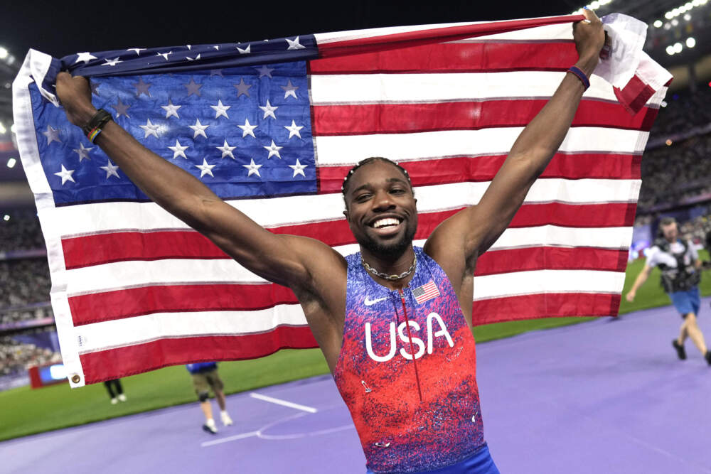 Noah Lyles, of the United States, celebrates after winning the men's 100-meters final at the 2024 Summer Olympics. (Bernat Armangue/AP)