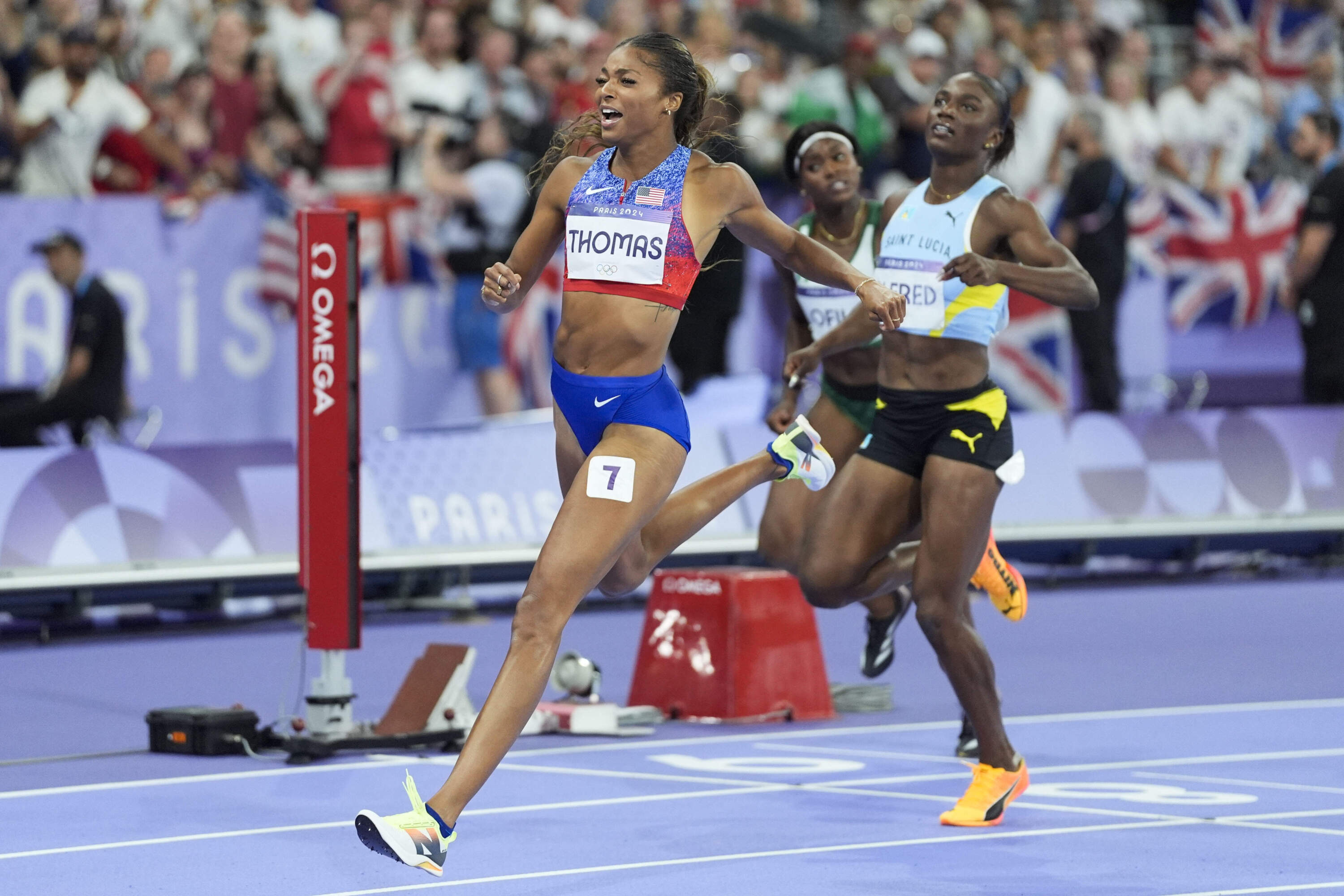 Gabrielle Thomas, of the United States, celebrates after winning the women's 200-meter final at the 2024 Summer Olympics, Tuesday, Aug. 6. (Matthias Schrader/AP)
