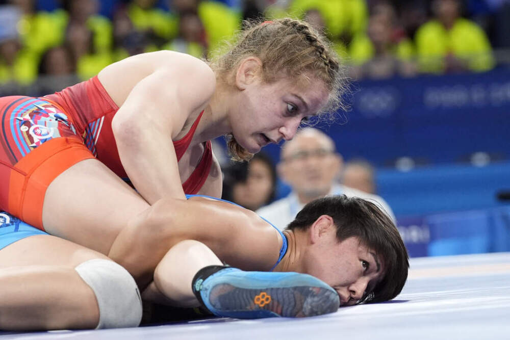 Amit Elor of the United States (top) and Meerim Zhumanazarova of Kyrgyzstan compete during their women's freestyle wrestling -68 kg final, Tuesday, Aug. 6, 2024, at the Champ de Mars arena during the 2024 Summer Olympics in Paris, France. (Eugene Hoshiko/AP)