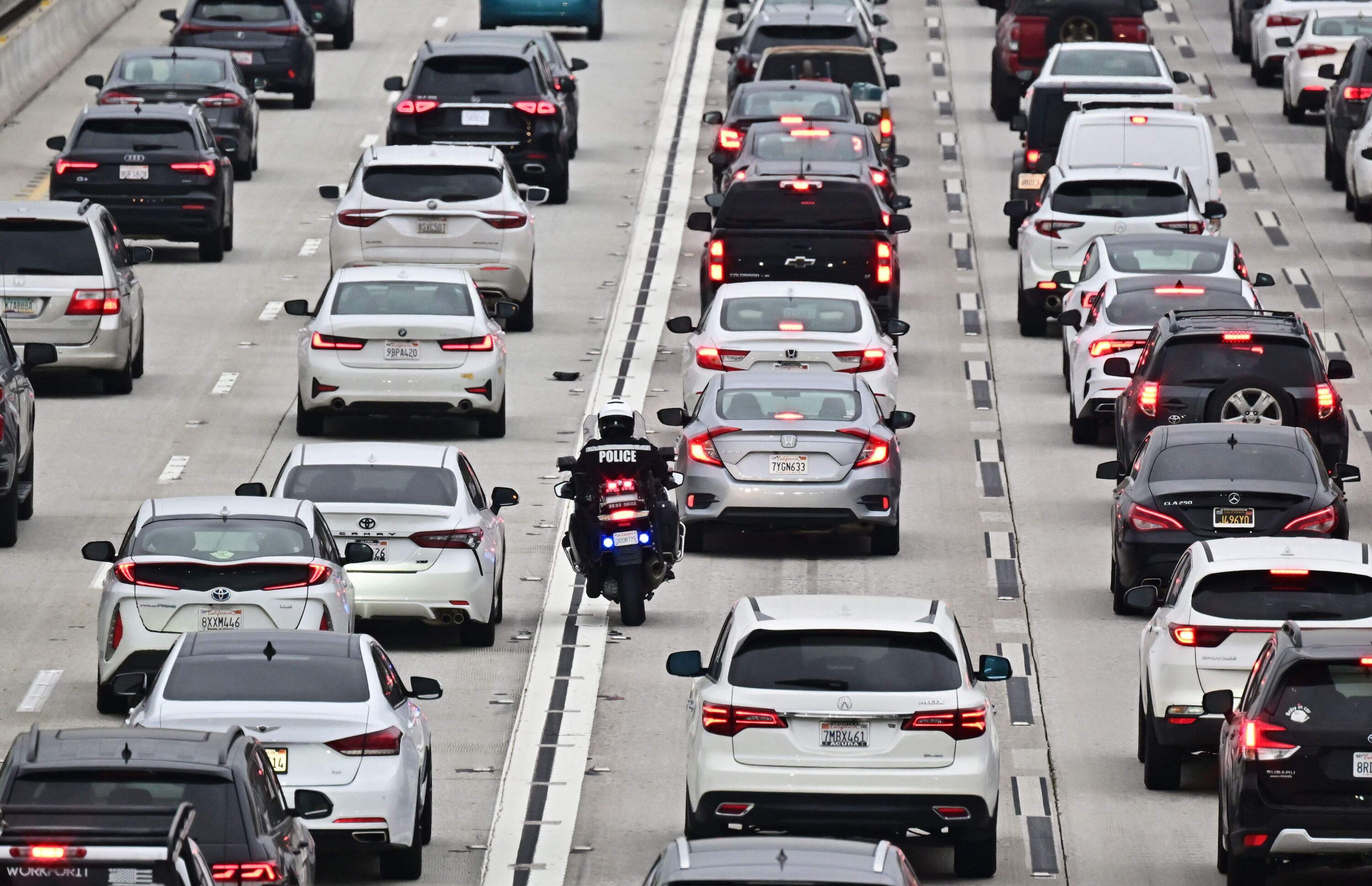 Car prices have come down consistently over 10 months after a spike during and after the pandemic sent prices skyrocketing. But insurance and maintenance costs are both up significantly from a year ago. (Frederic J. Brown/AFP via Getty Images)