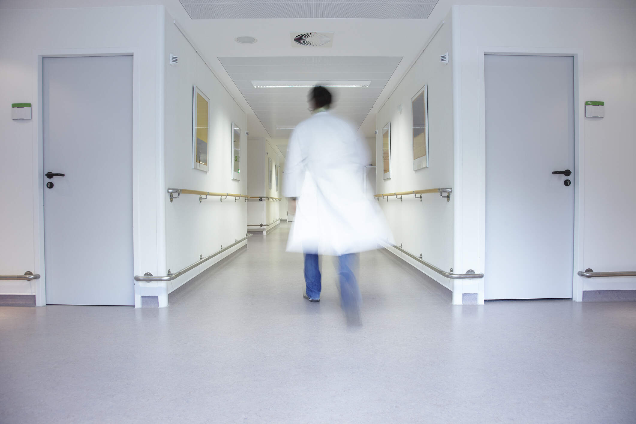Doctor walking along a hospital floor. (Getty Images)