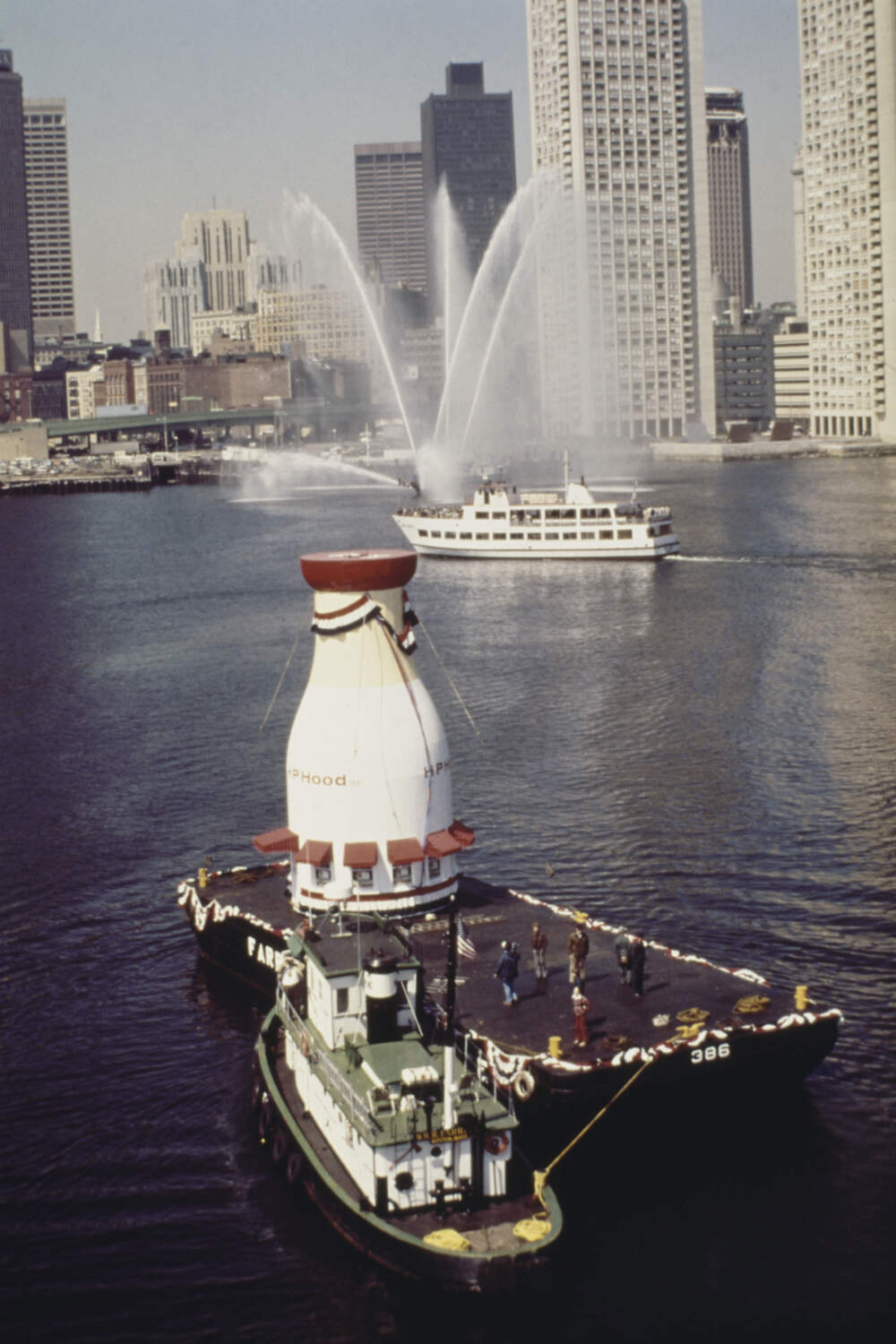 The 40-foot-long milk bottle is transported by barge into Boston Harbor on April 22, 1977. (Photo by UPI/Bettmann Archive/Getty Images)