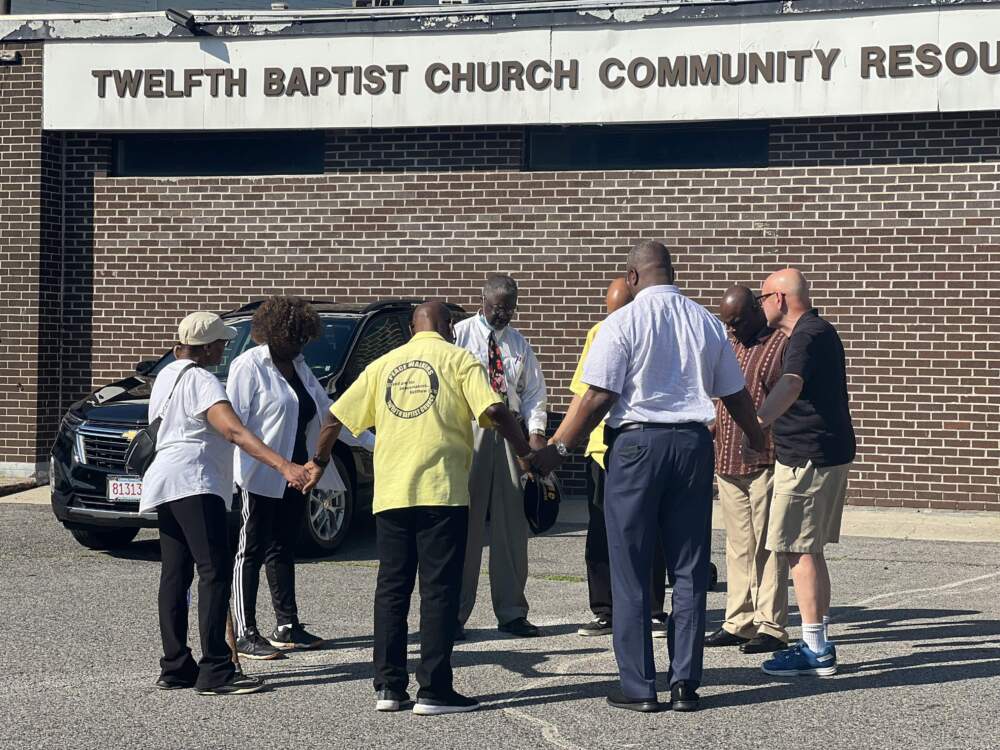 Members of various community groups, including the Rev. Colin Leitch and Boston Police Commissioner Michael Cox, gather for a prayer during a peace walk in Boston's Roxbury neighborhood. (Courtesy Boston Police Department)