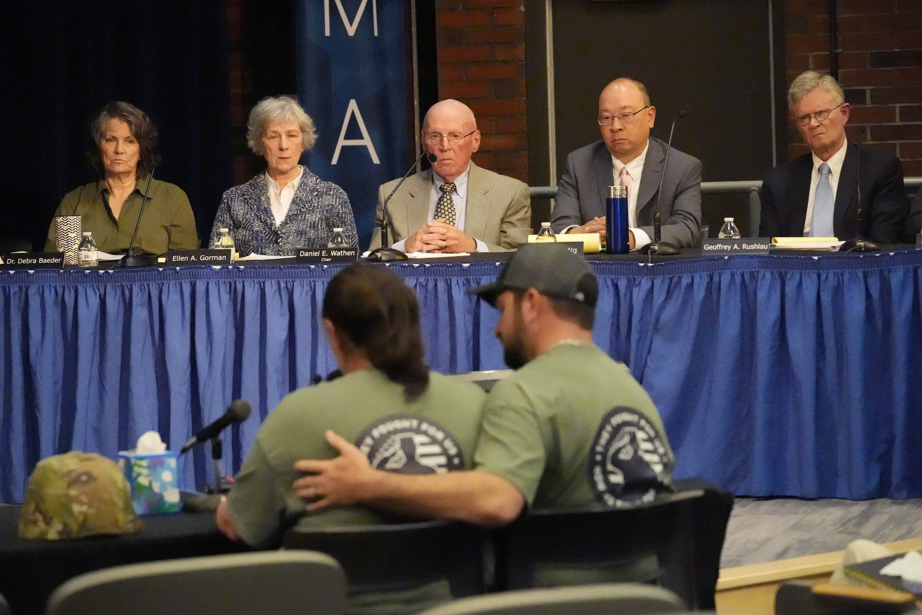Members of the independent commission investigating the law enforcement response to the mass shooting in Lewiston, Maine, listen as family members of shooter Robert Card, testify Thursday, May 16, 2024, in Augusta, Maine. (Robert F. Bukaty/AP)
