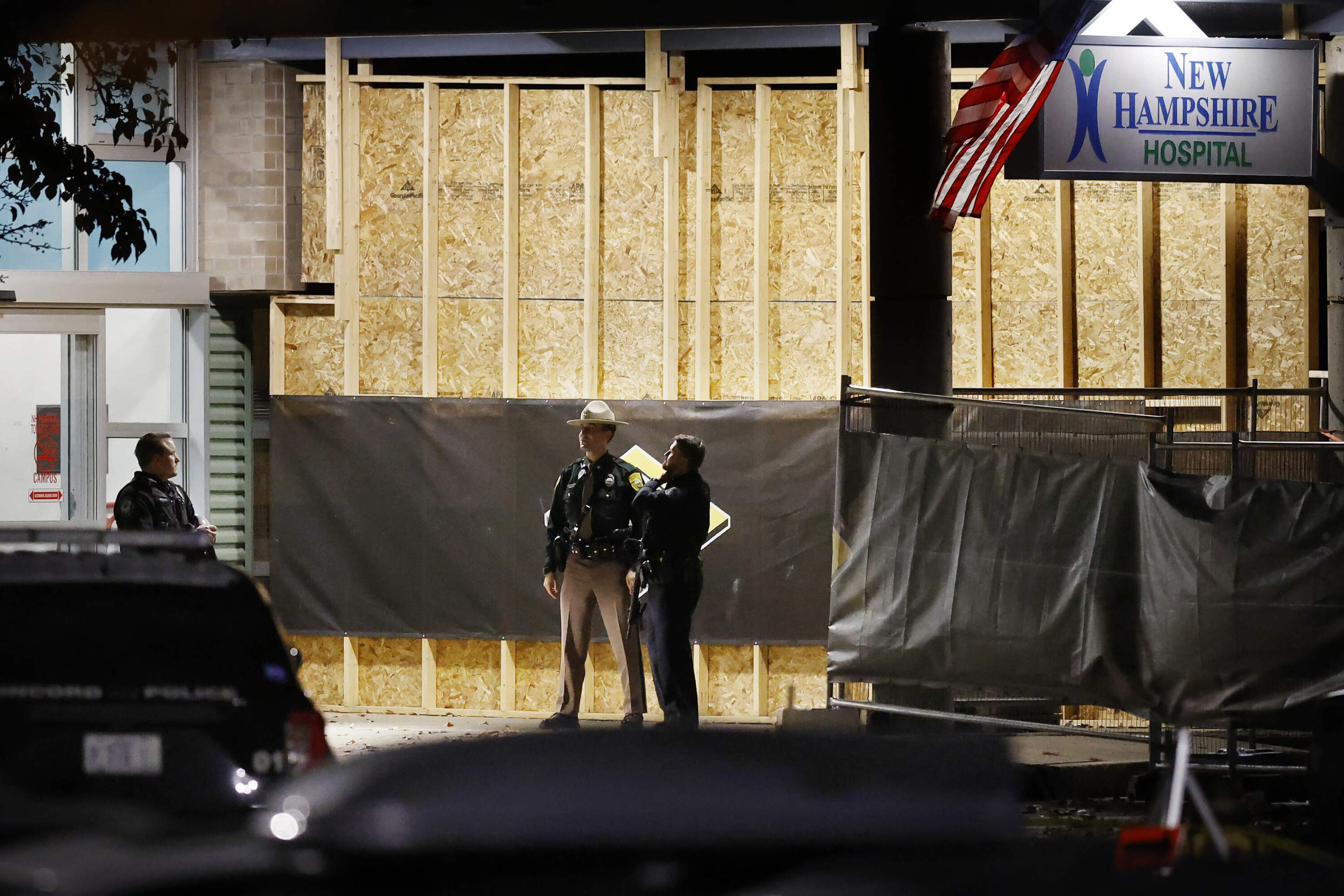 Police stand at the entrance to New Hampshire Hospital, Nov. 17, 2023, in Concord, N.H. (Michael Dwyer/AP)