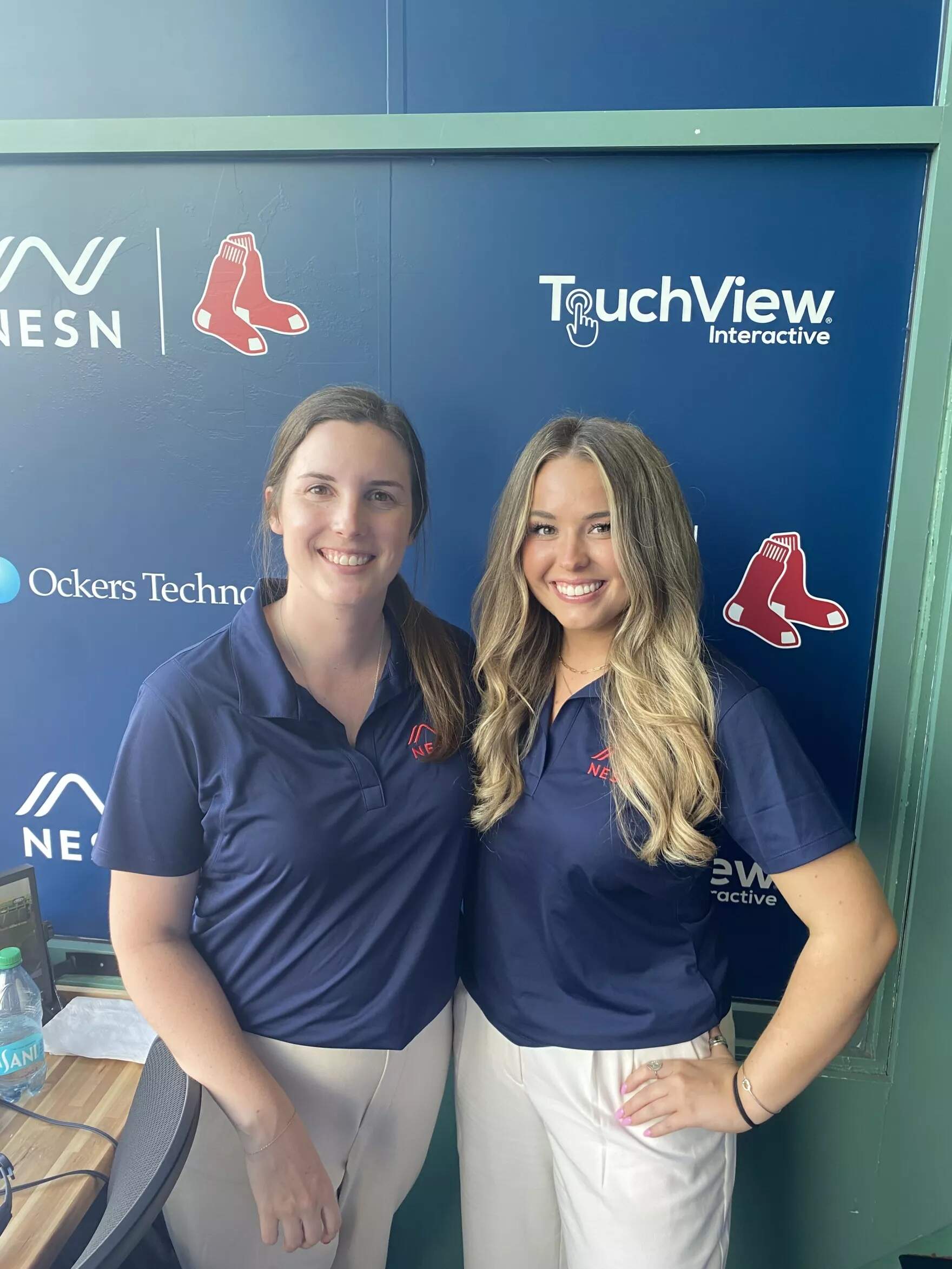 Portland Sea Dogs broadcasters Emma Tiedemann, left, and Rylee Pay, right, in the NESN booth on August 26, 2024. (Courtesy of Emma Tiedemann)