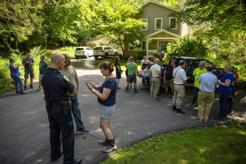Southbury officials meet with residents at the home of Gerard Orozco which backs up to an earthen dam that gave way in the catastrophic rains of August 18, 2024. (Mark Mirko/Connecticut Public)
